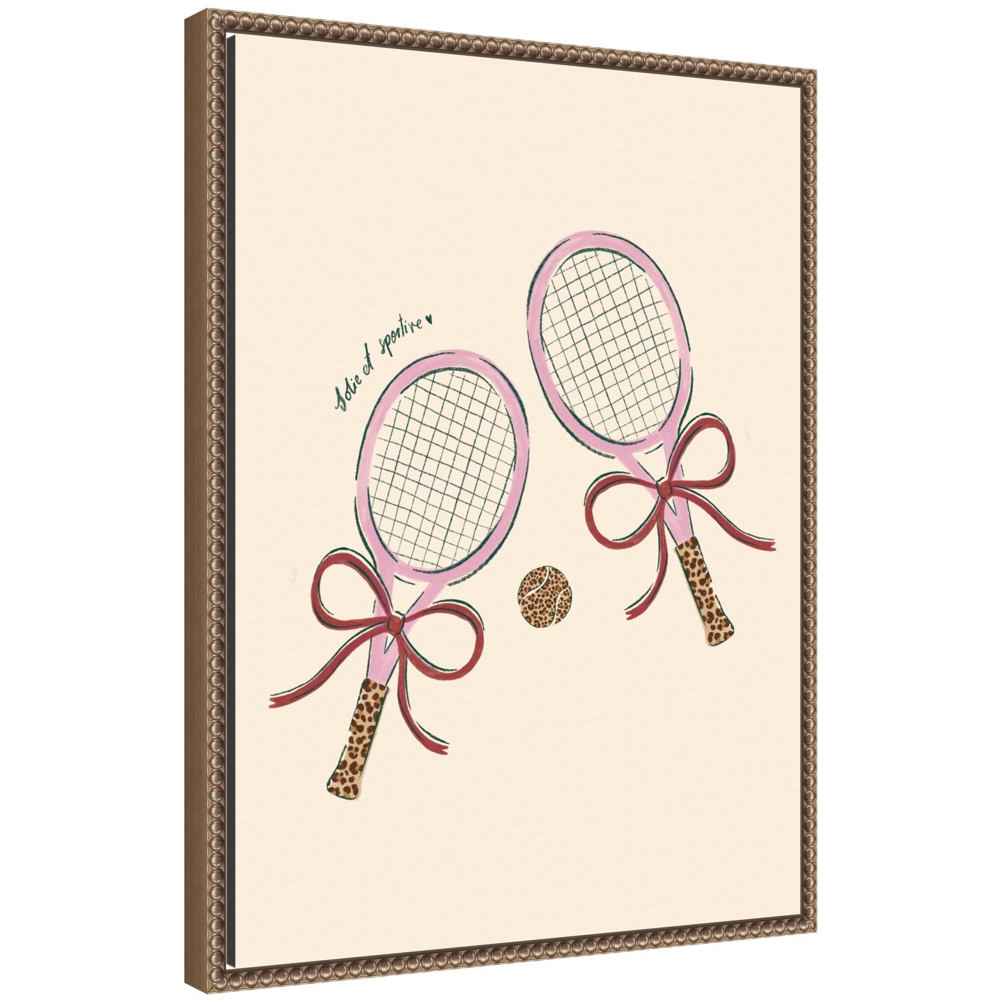 Framed canvas wall art print showing two pink tennis rackets with leopard patterned grips and bows alongside a pink tennis ball on a neutral background, set in a dark gold ornate vintage frame.