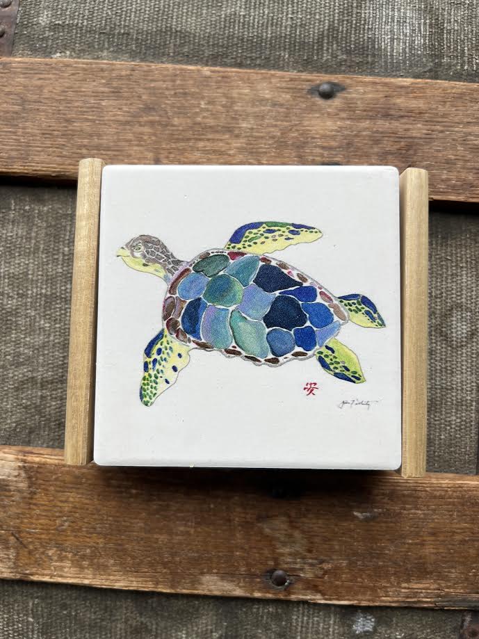 Sea Turtle Coaster set with detailed sea turtle design on a wood caddy holder, styled on a coastal-themed table