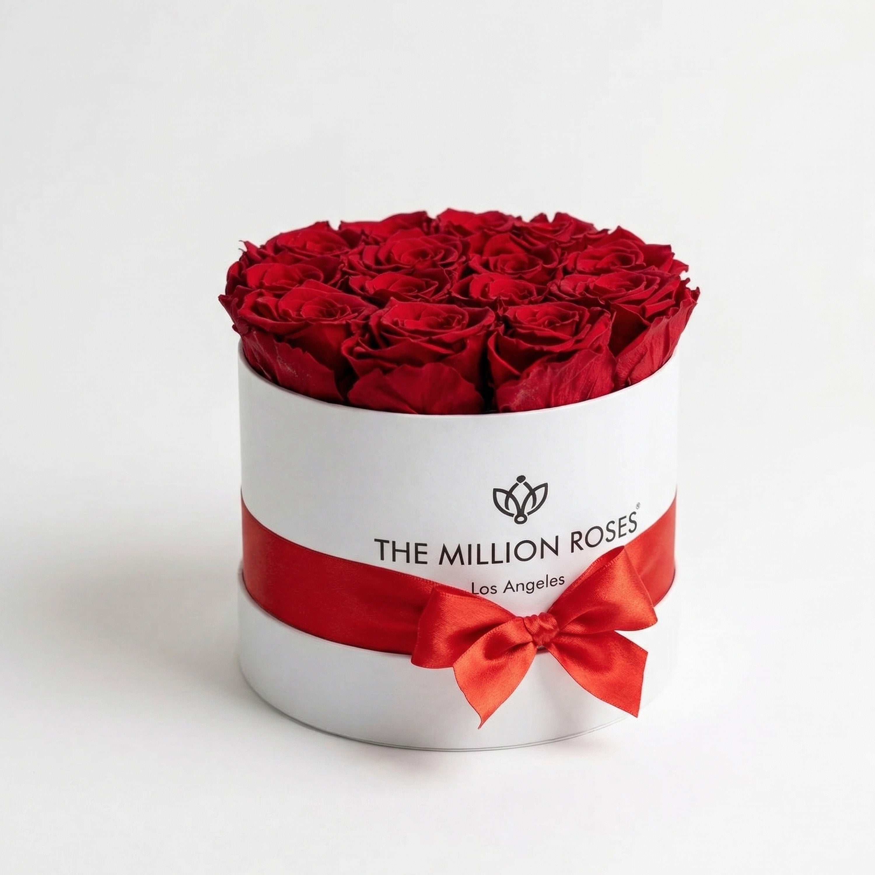 Classic White Box containing 14-15 naturally preserved red roses arranged in a white box by The Million Roses.