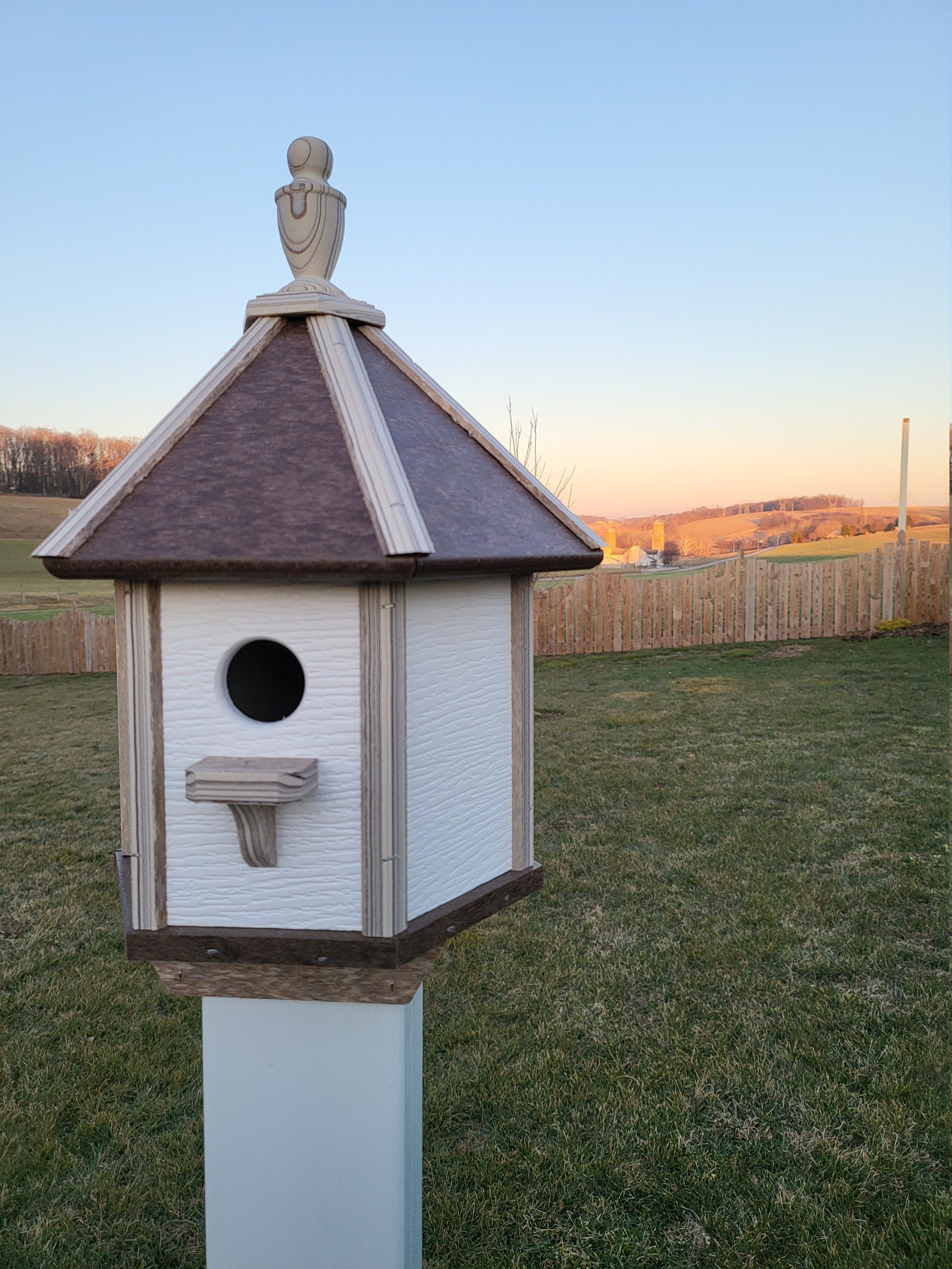 Handcrafted Amish poly birdhouse with one hole, shown mounted outdoors