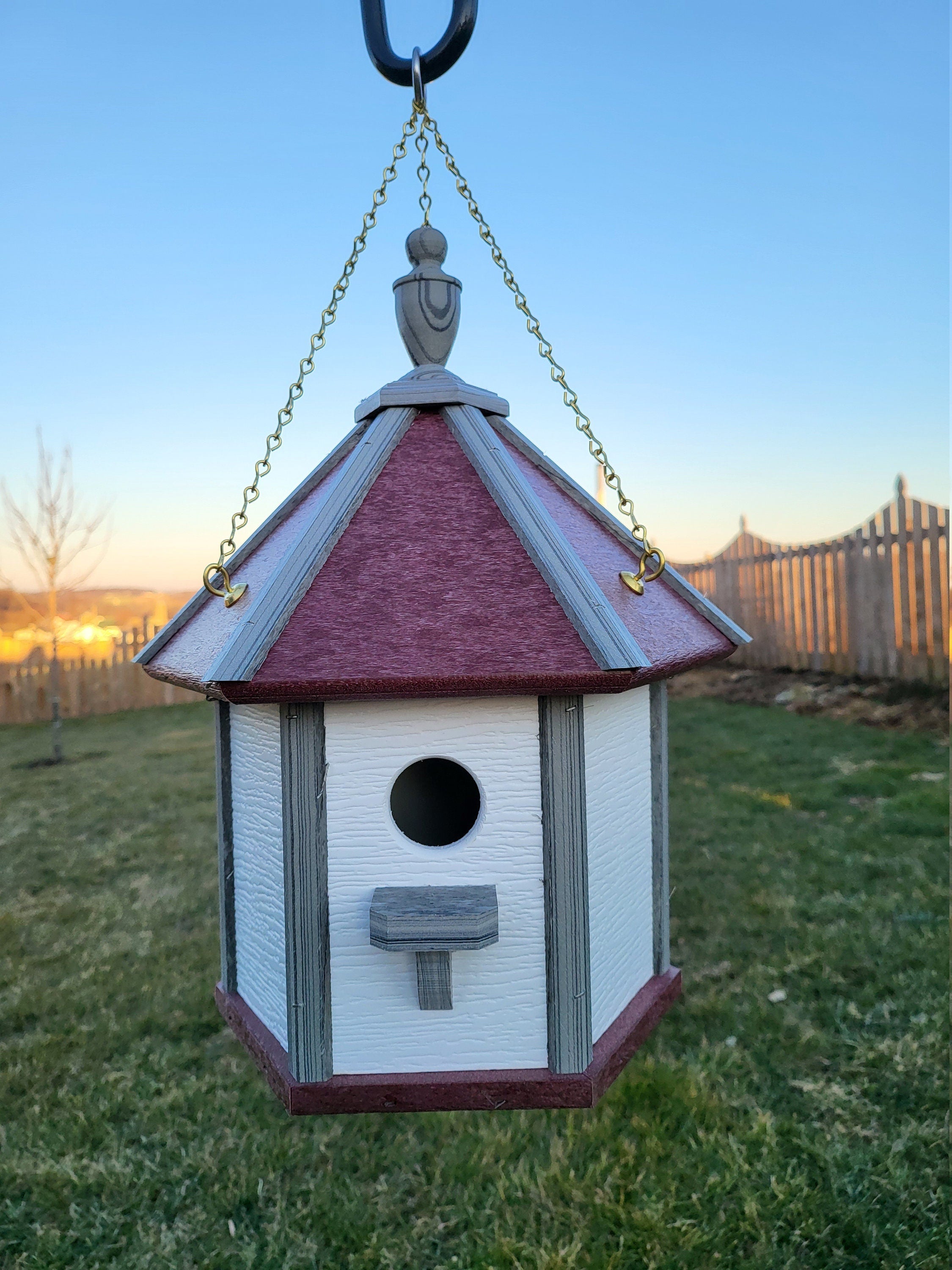 Handcrafted Amish poly birdhouse with one hole, shown mounted outdoors