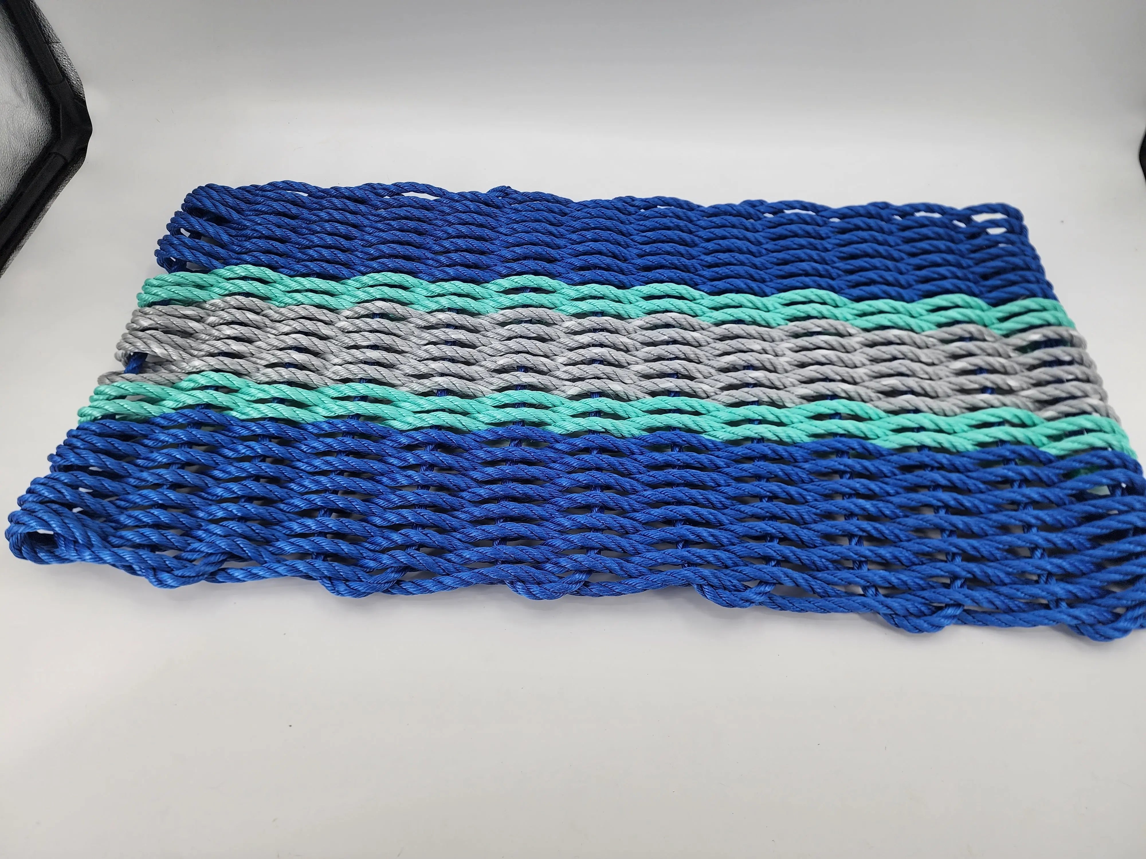 Handmade lobster rope door mat in blue, light gray, and teal accents