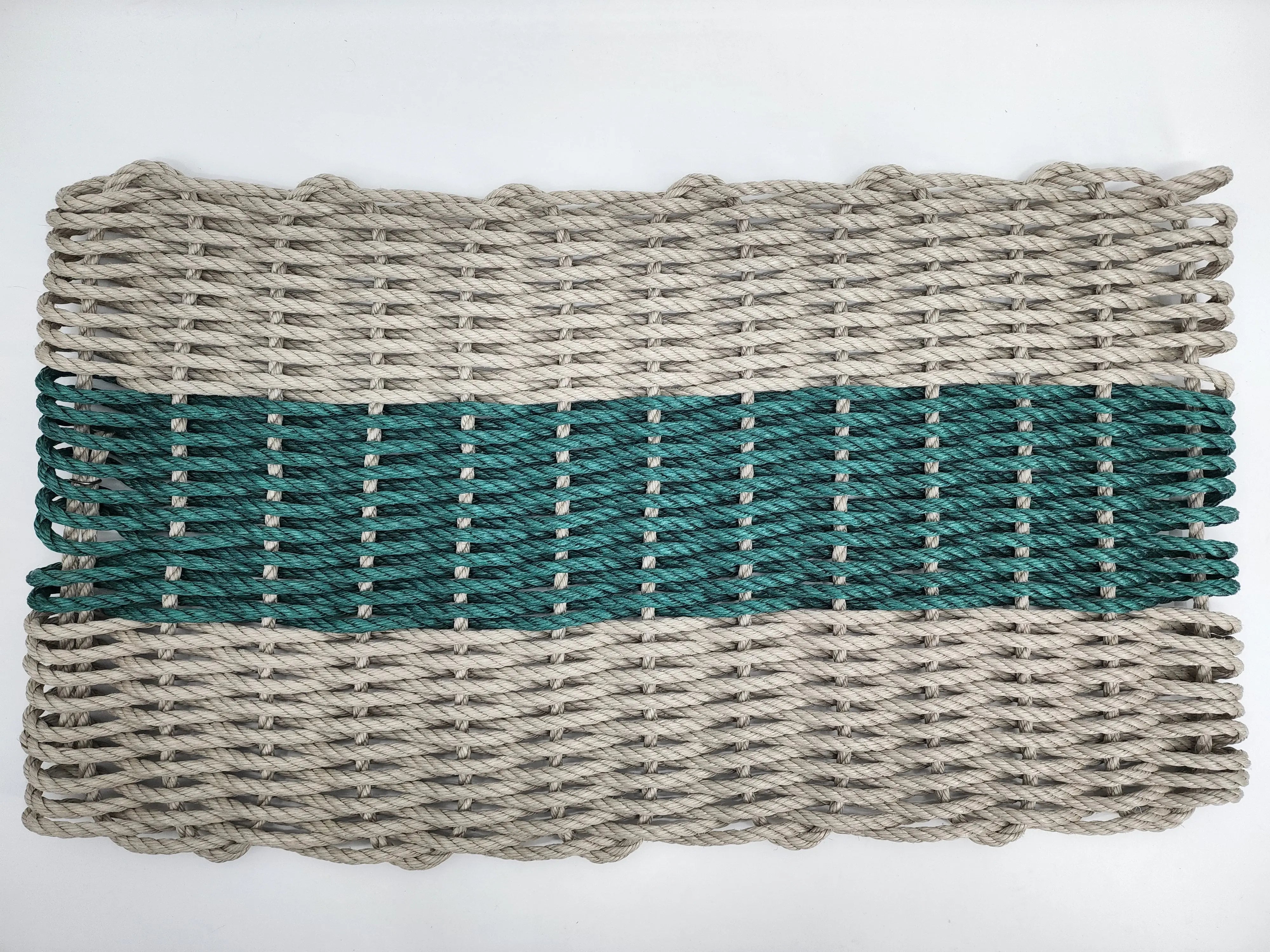 Tan and hunter green handmade lobster rope mat made from lobster trap rope