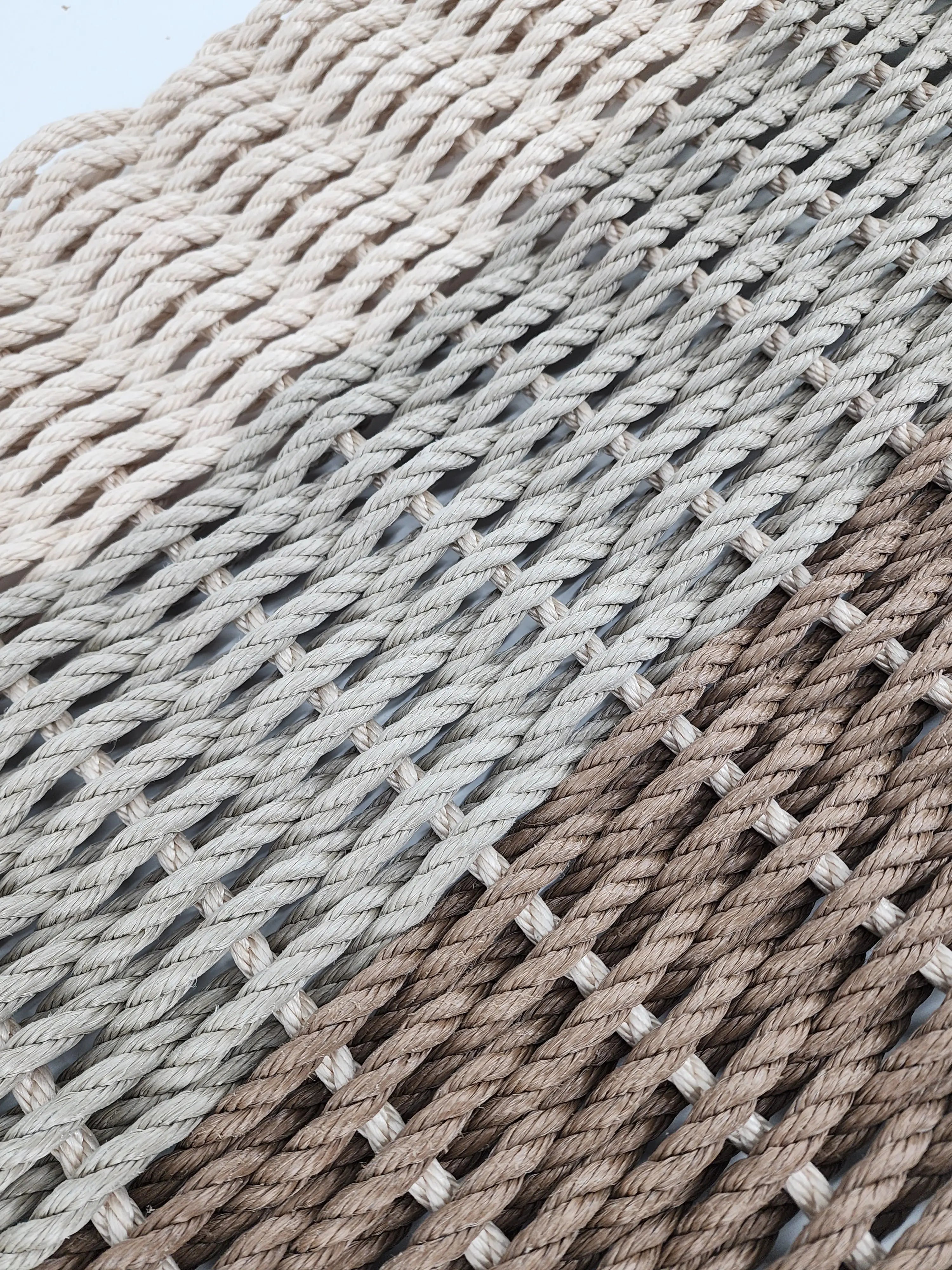 Brown, tan, and light tan ombre handmade rope mat by Little Salty Rope