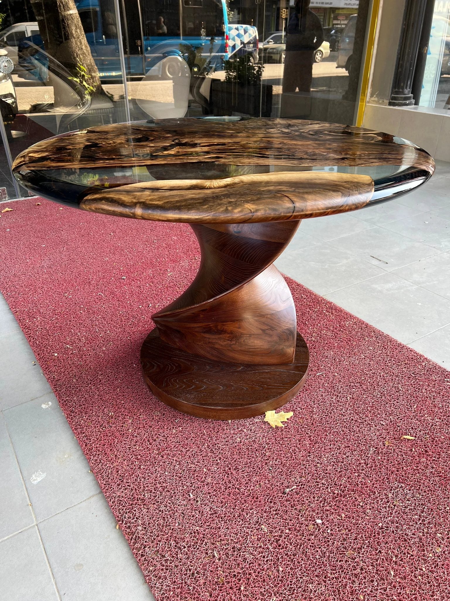 Round epoxy resin dining table with walnut wooden vortex base