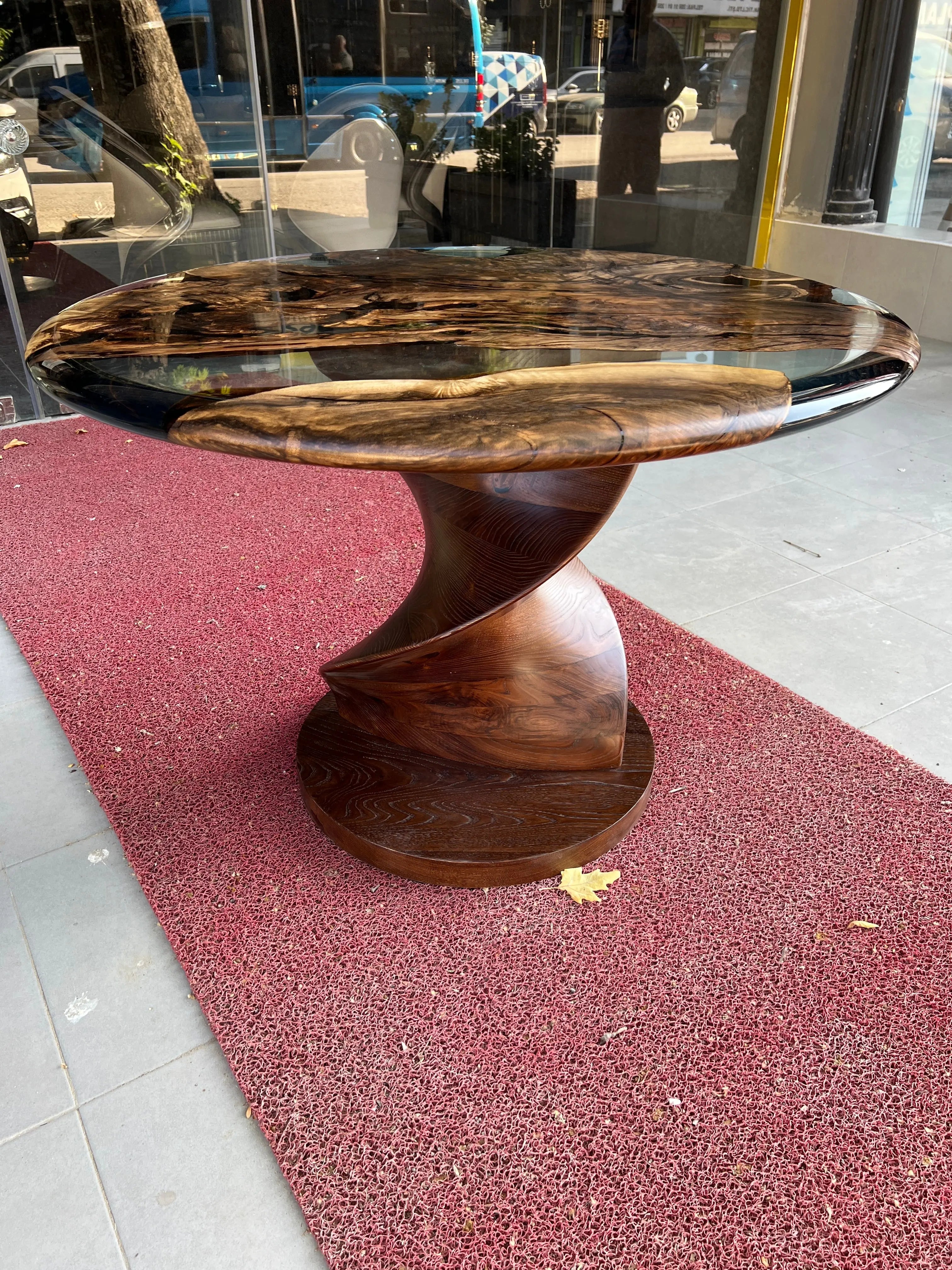Round epoxy resin dining table with walnut wooden vortex base