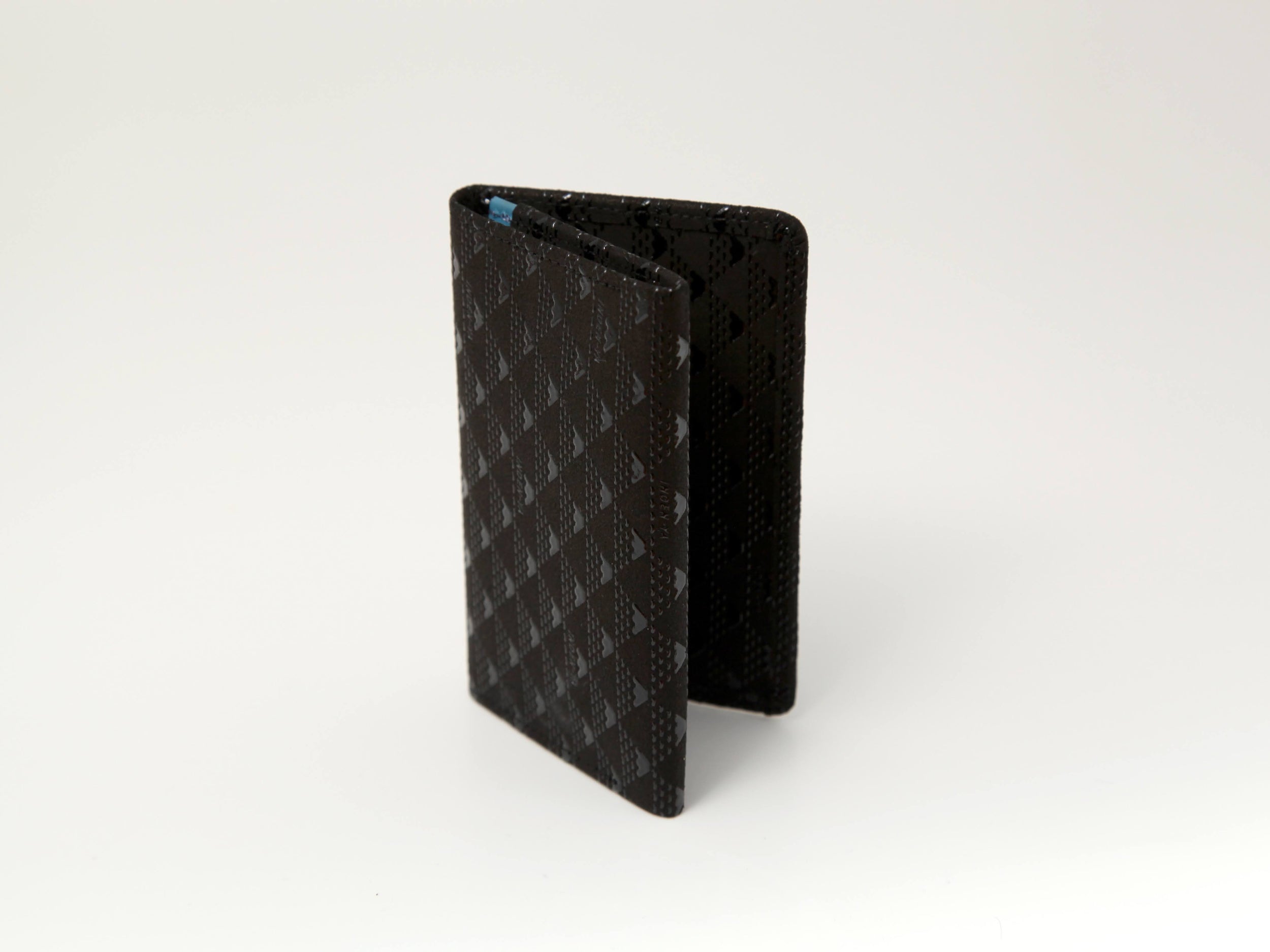 Takane Business Card Case in Black x Black color showing lacquered deer leather exterior and compact design