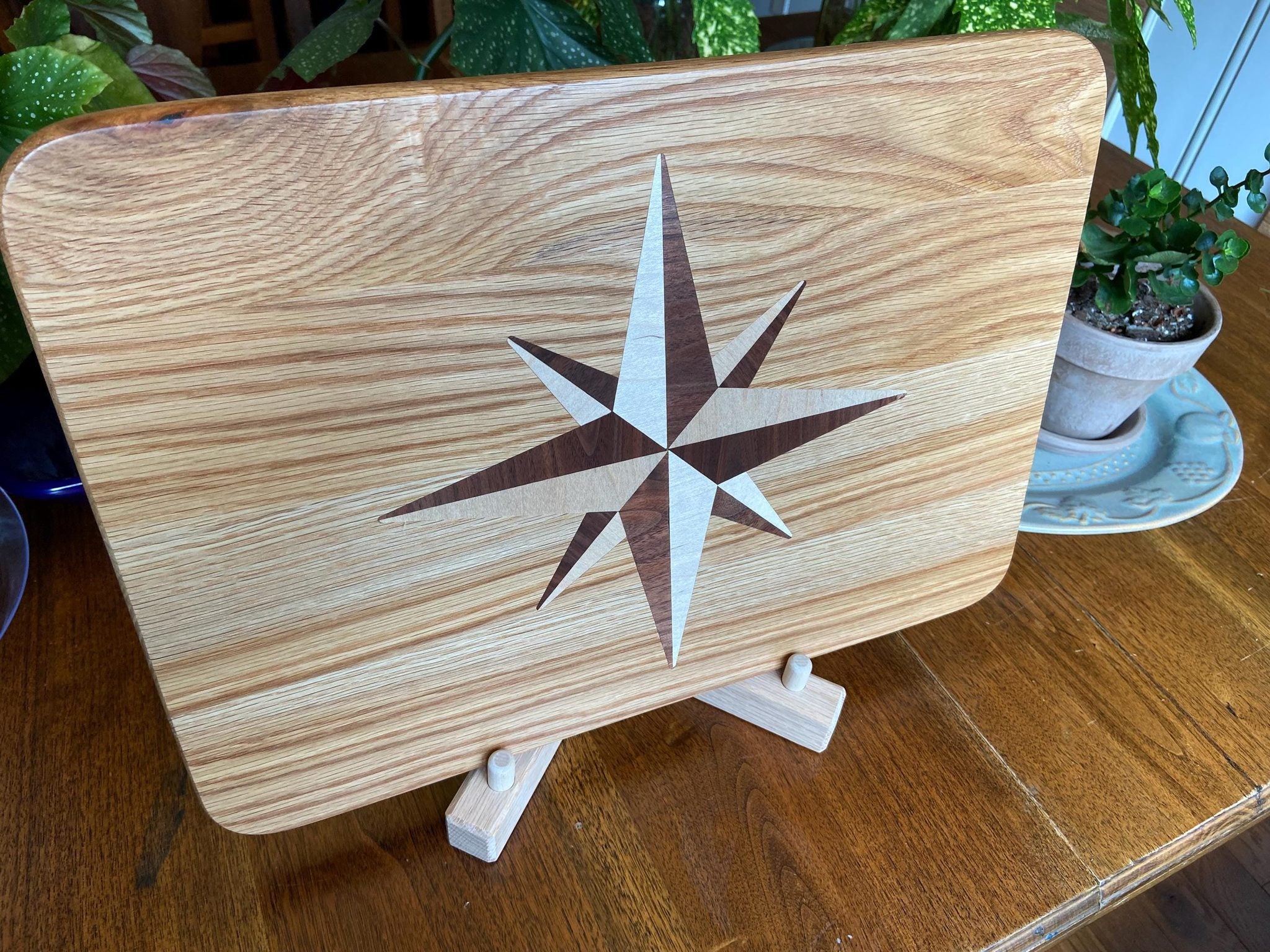 Handcrafted white oak charcuterie board with compass rose inlay