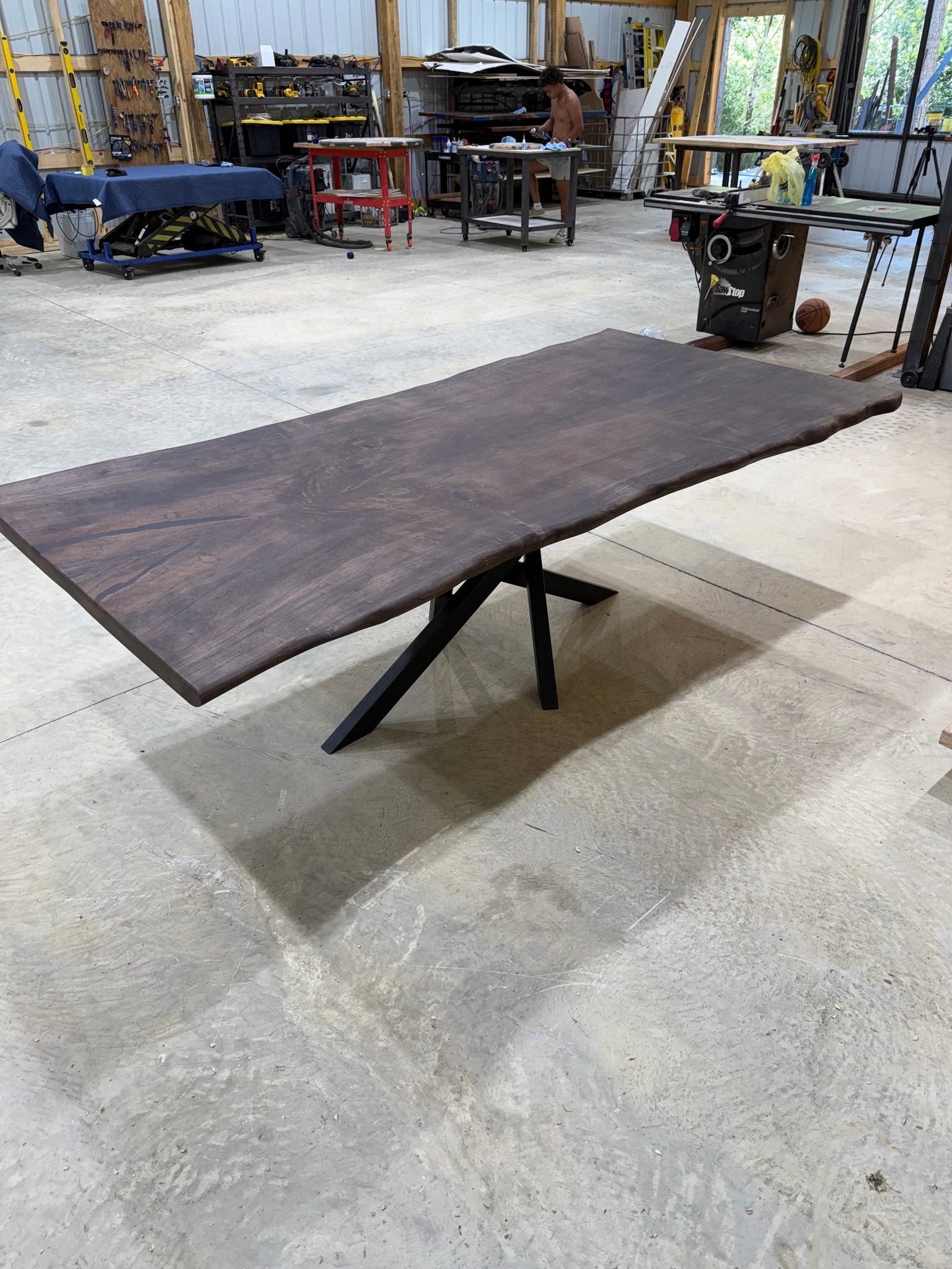 8x~4 Maple Slab Table with chocolate stain and spyder base by Sasquatch Tables LLC