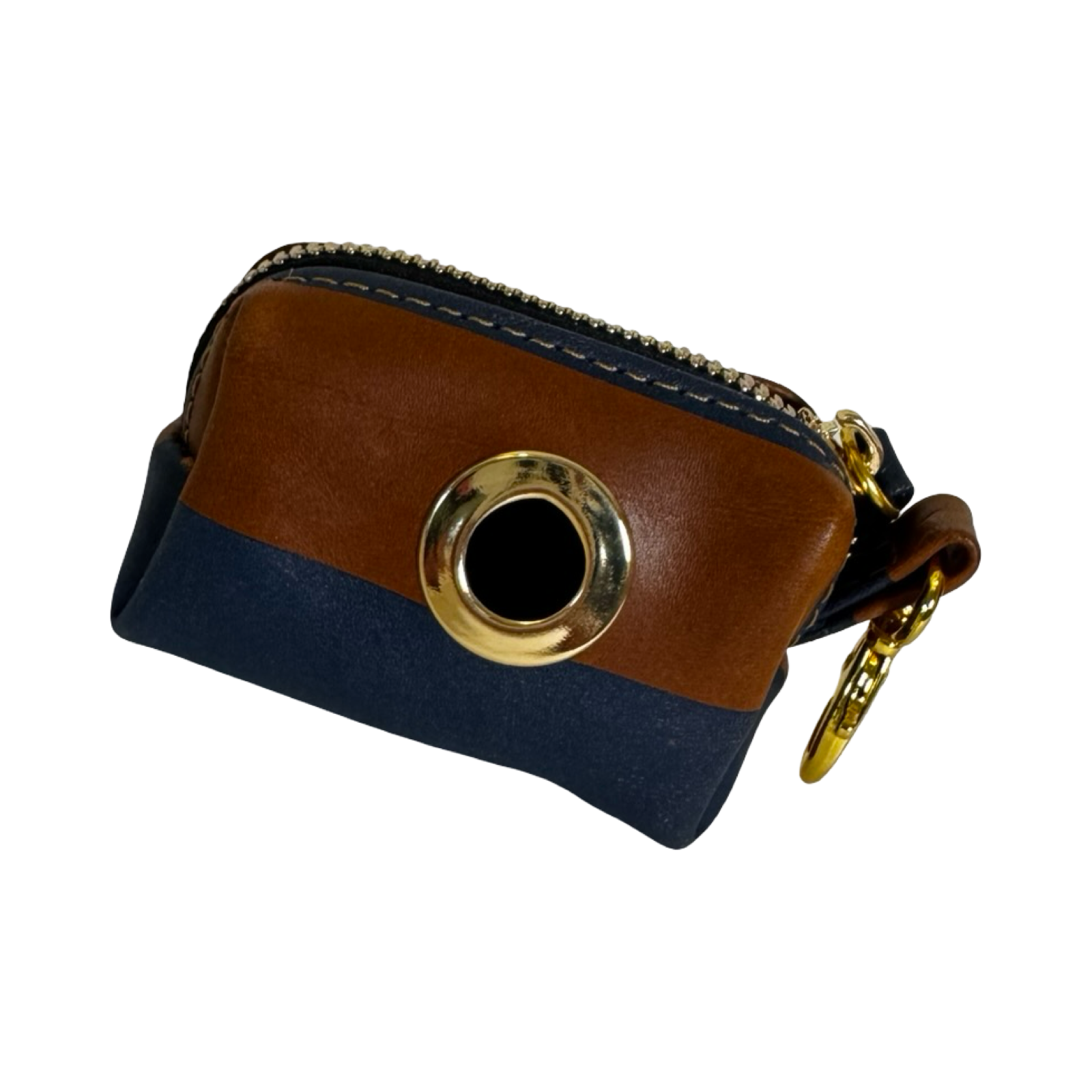 Riviera Poo Bag Purse in Cognac and Navy Italian Leather with gold hardware displayed on a textured wooden surface.