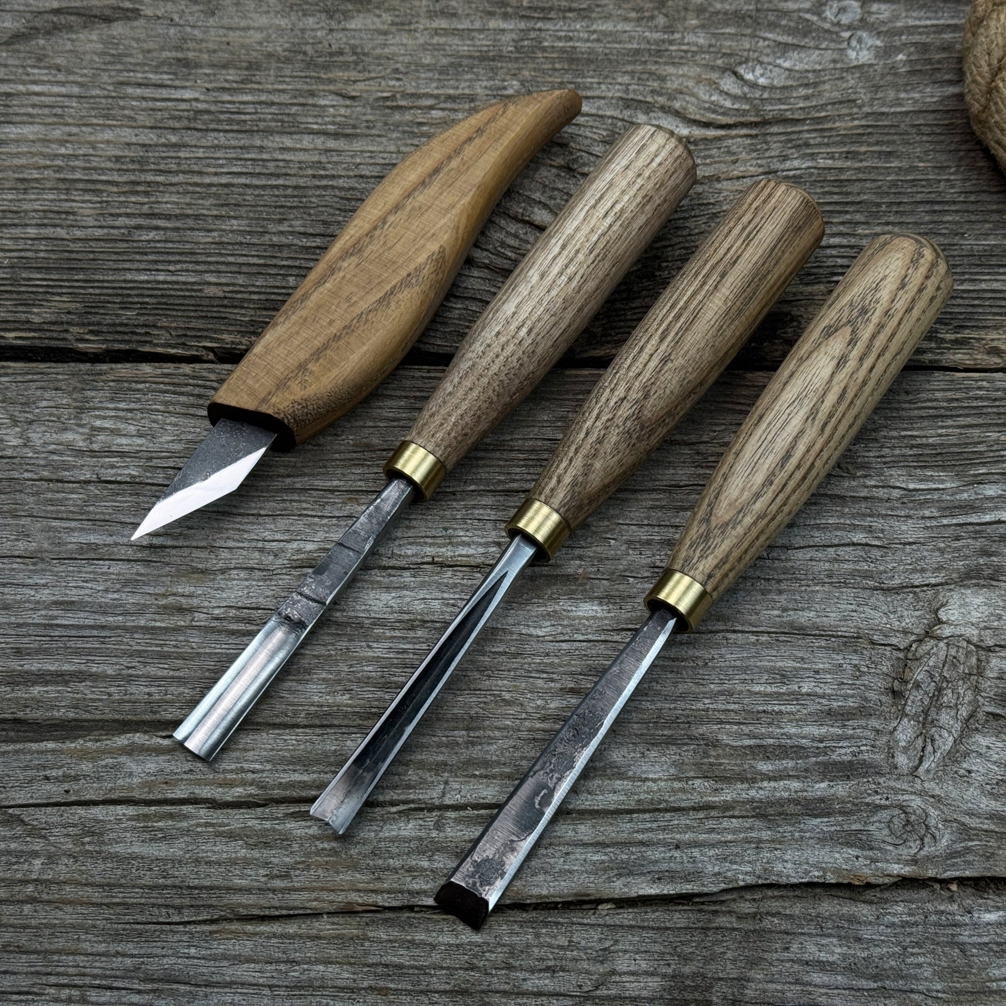 4-piece hand-forged wood carving tool set with ash wood handles and steel blades