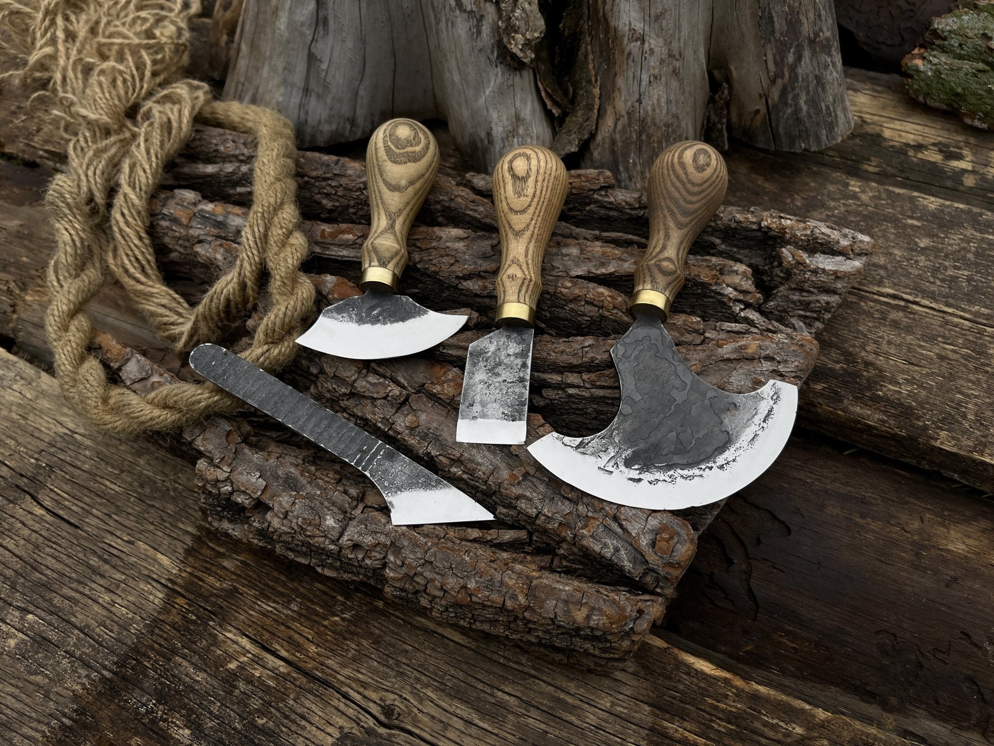 4-piece leatherworking tool set with hand-forged carbon steel blades and ash wood handles