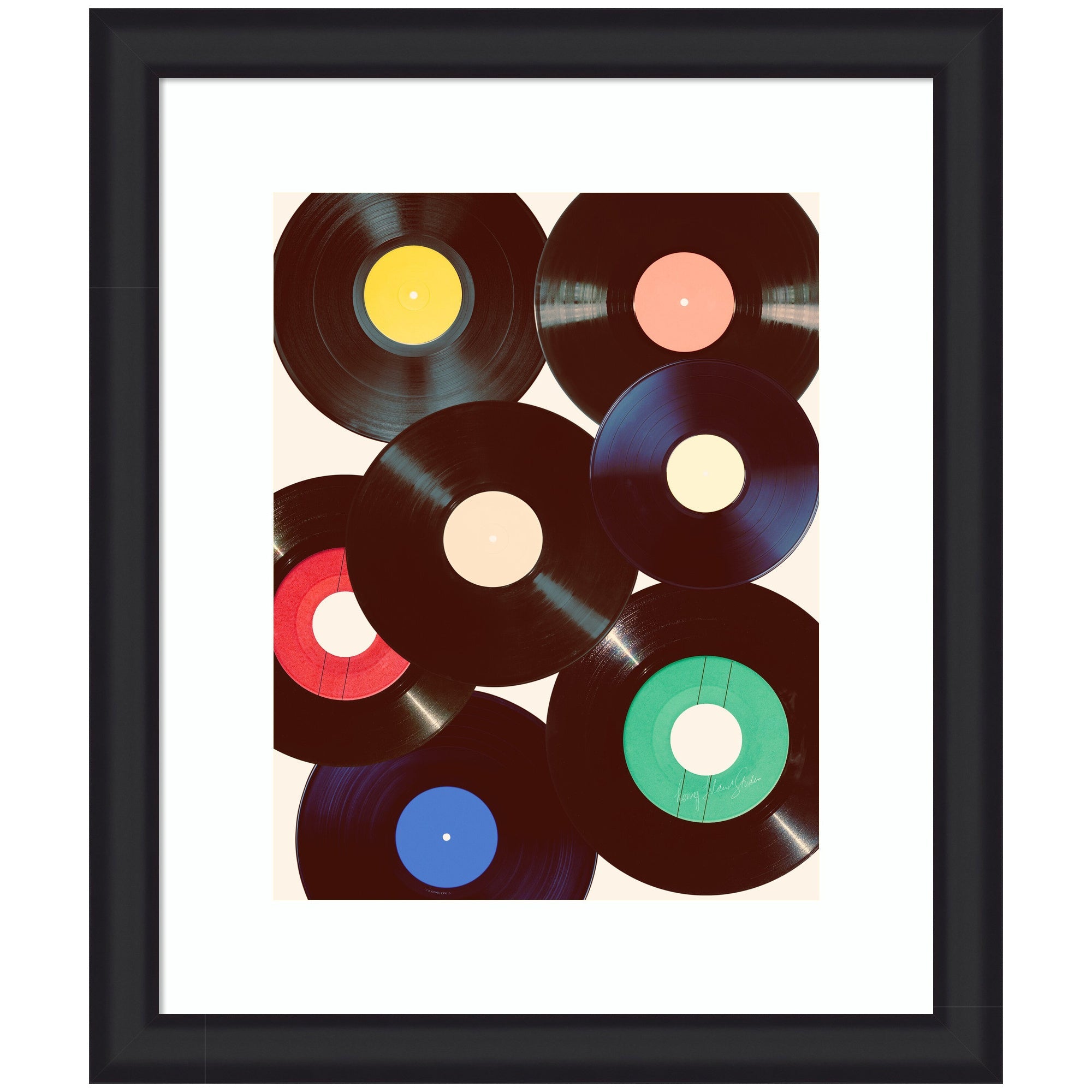 Framed art print showing colorful vinyl records collage by Honey Island Studio in vintage moulding frame
