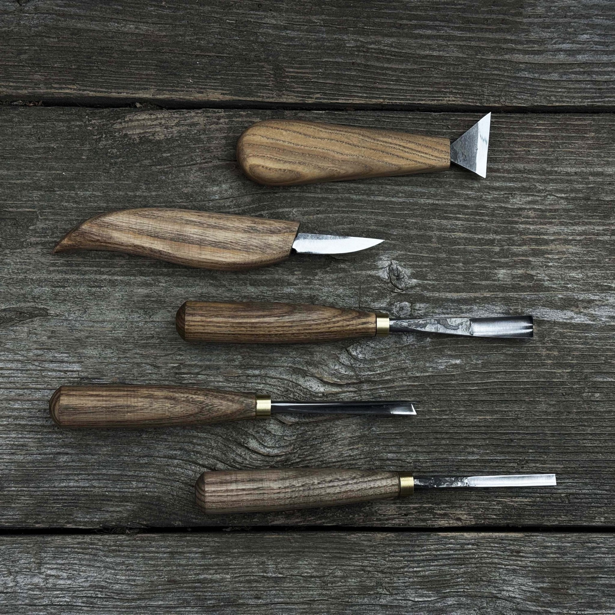 5-piece wood carving tool set including carving knives, chisels, and gouges with wooden handles