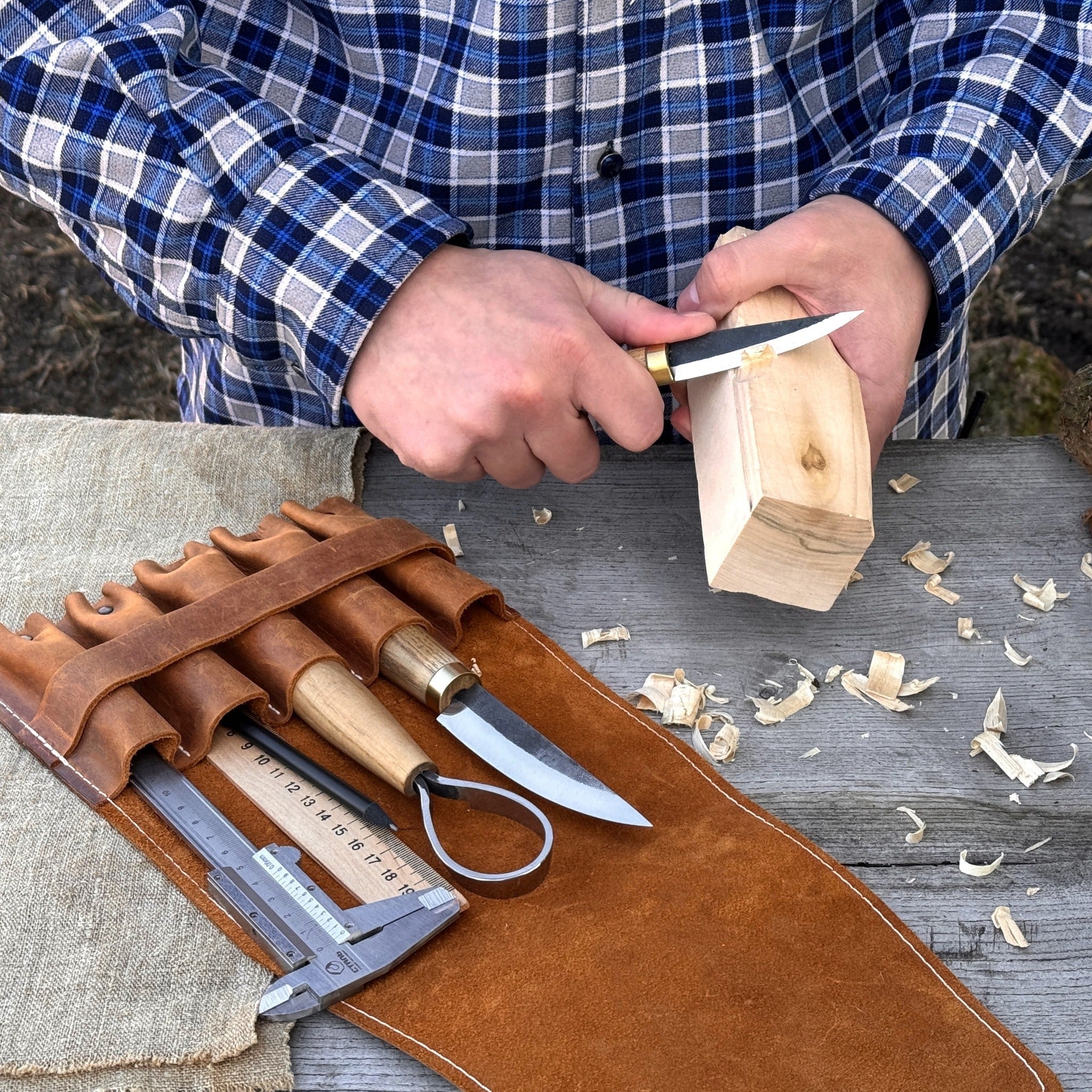 5-pocket leather tool case made from Crazy Horse leather with five tool pockets and leather strap closure