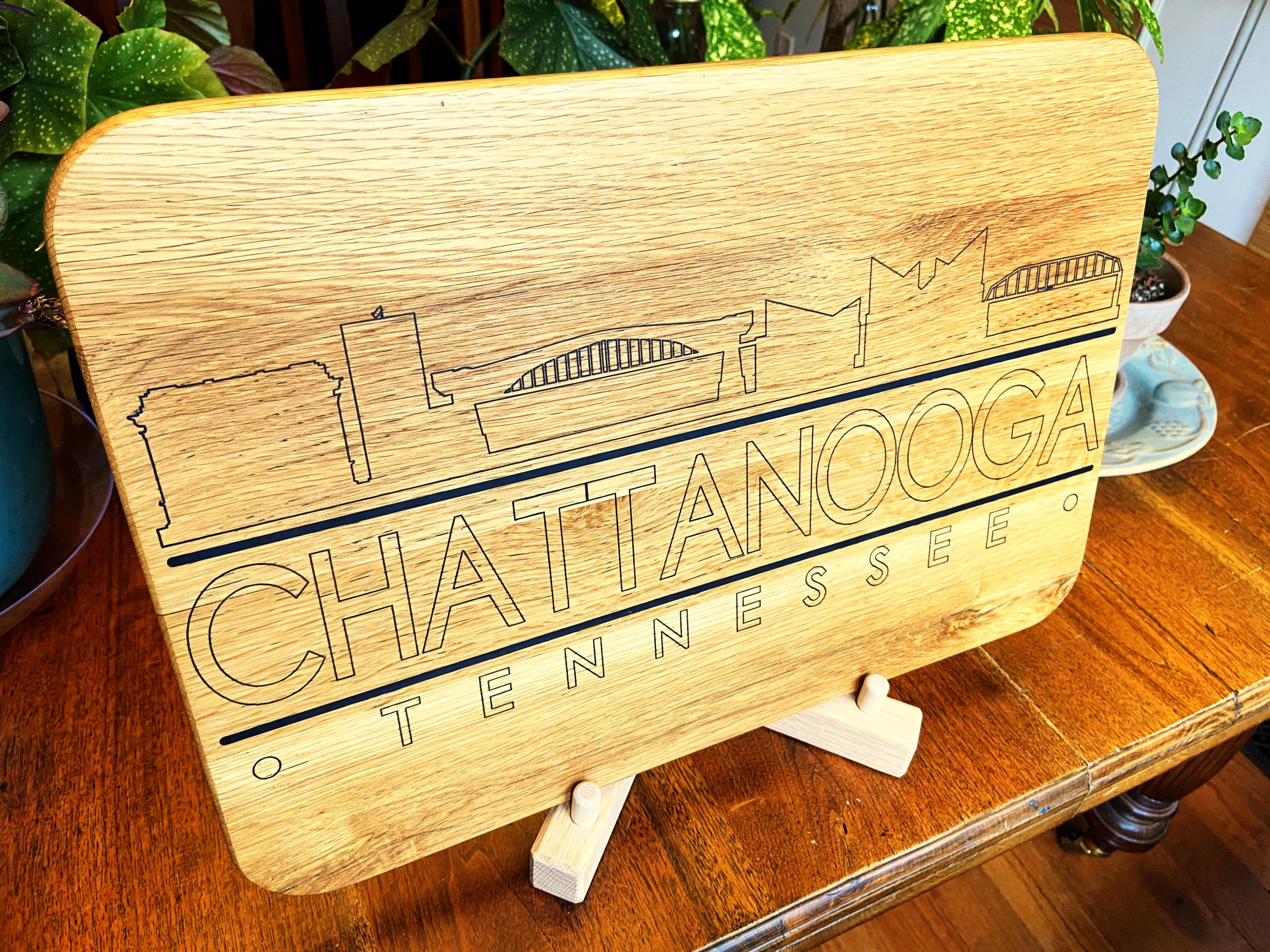 Handmade white oak charcuterie board with engraved Chattanooga skyline