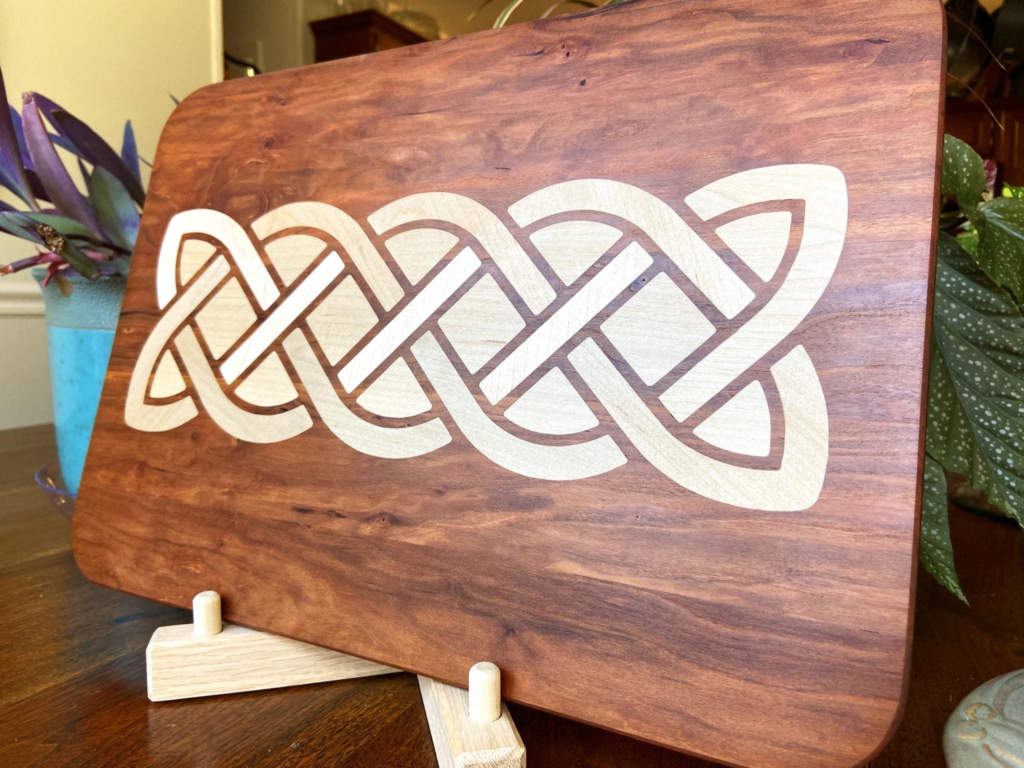 Cherry charcuterie board with complex Celtic knot inlay on White Oak wood