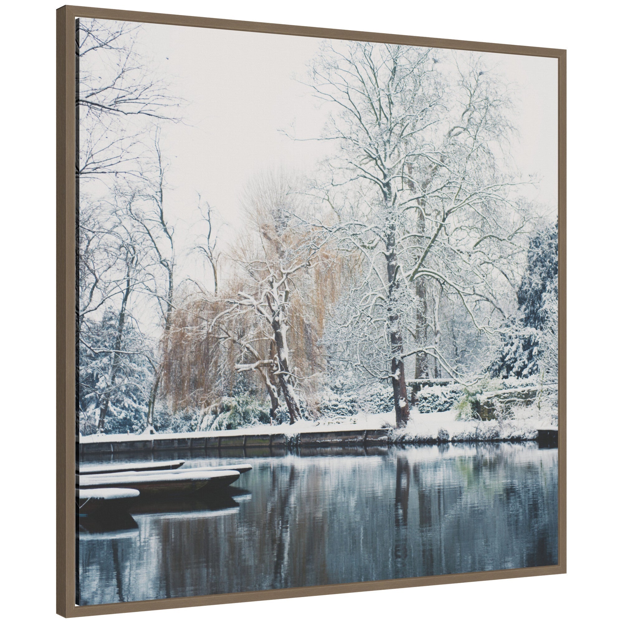 Sylvie framed canvas depicting snow-covered punts on the River Cam with bare trees and reflective water