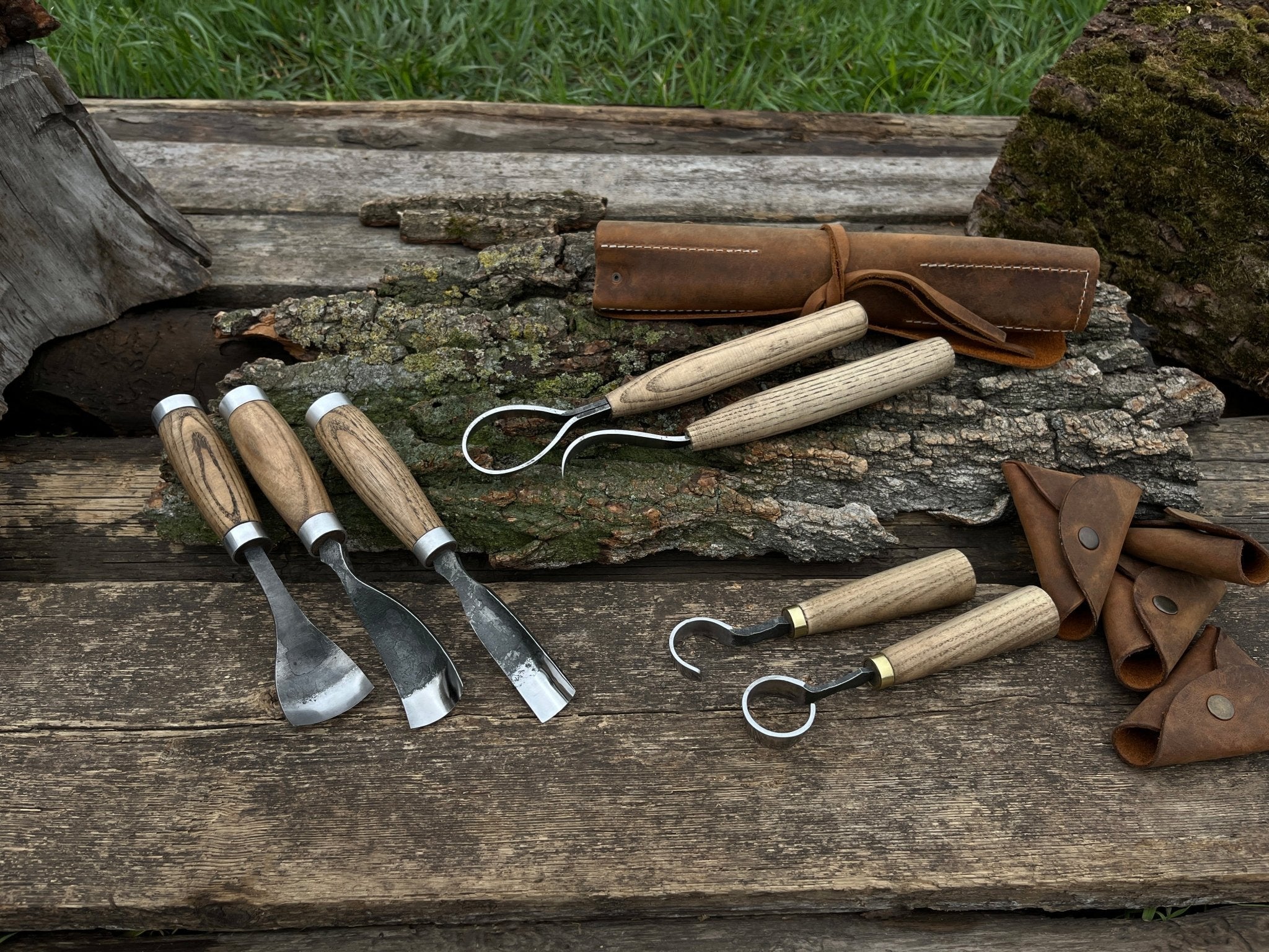 7-piece hand-forged wood carving tool set with ash wood handles and leather cases