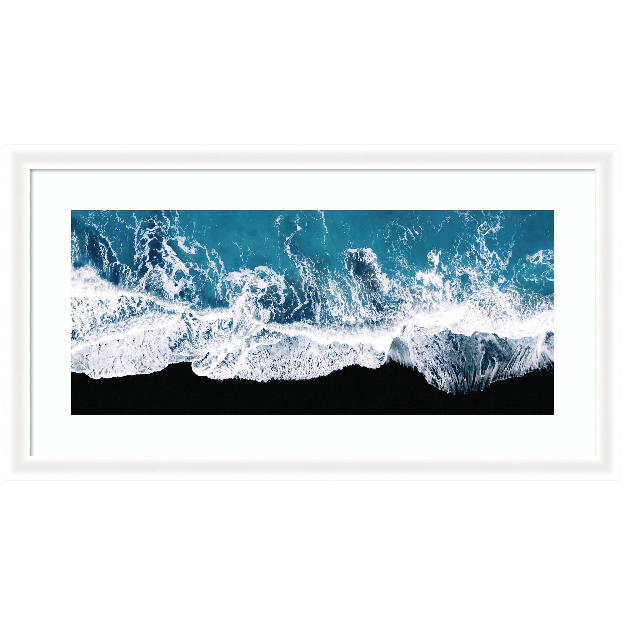 Framed minimalist art print showing aerial view of ocean waves crashing on a black beach in Iceland by Michael Schauer