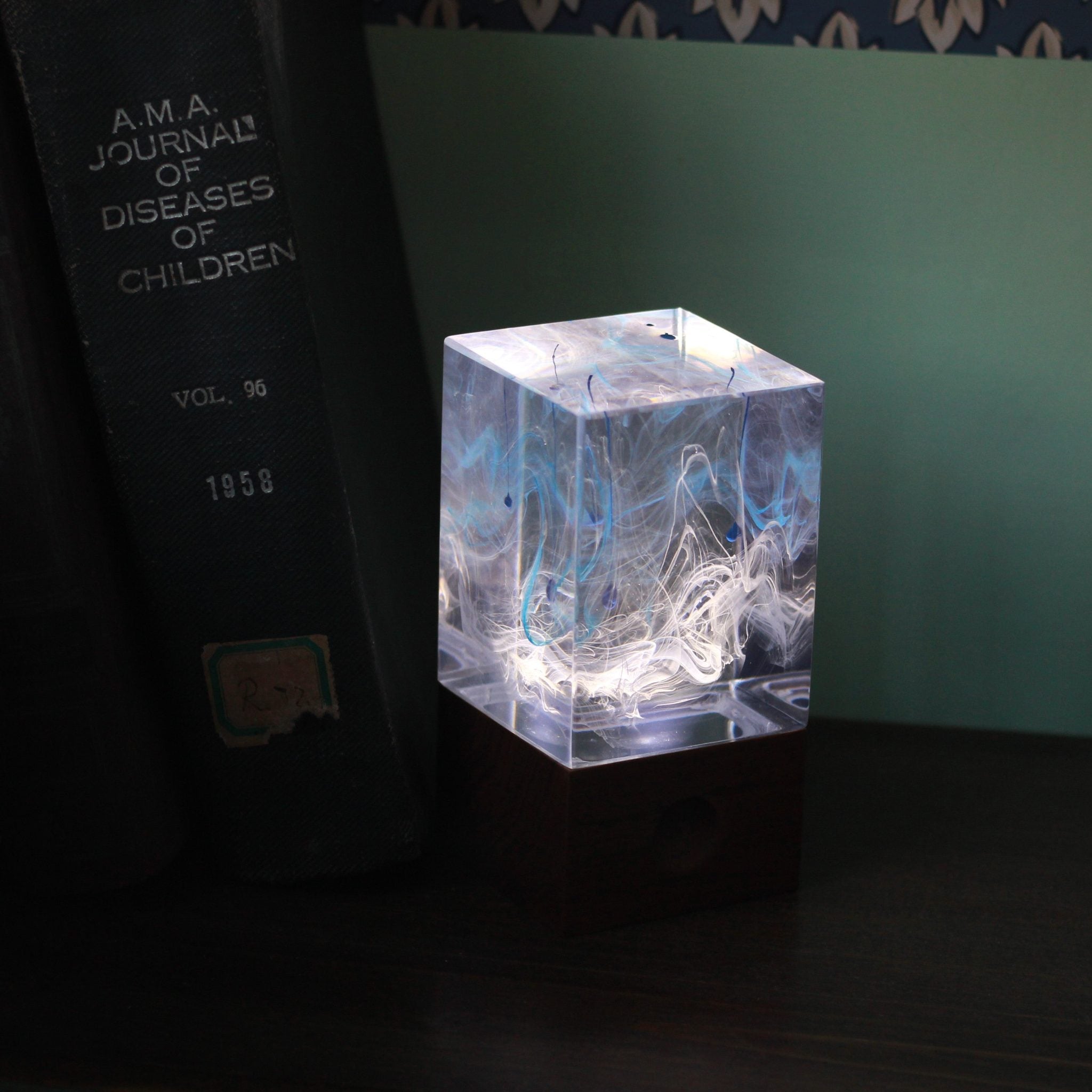 Handcrafted resin table lamp with ocean-inspired colors and warm white LED light