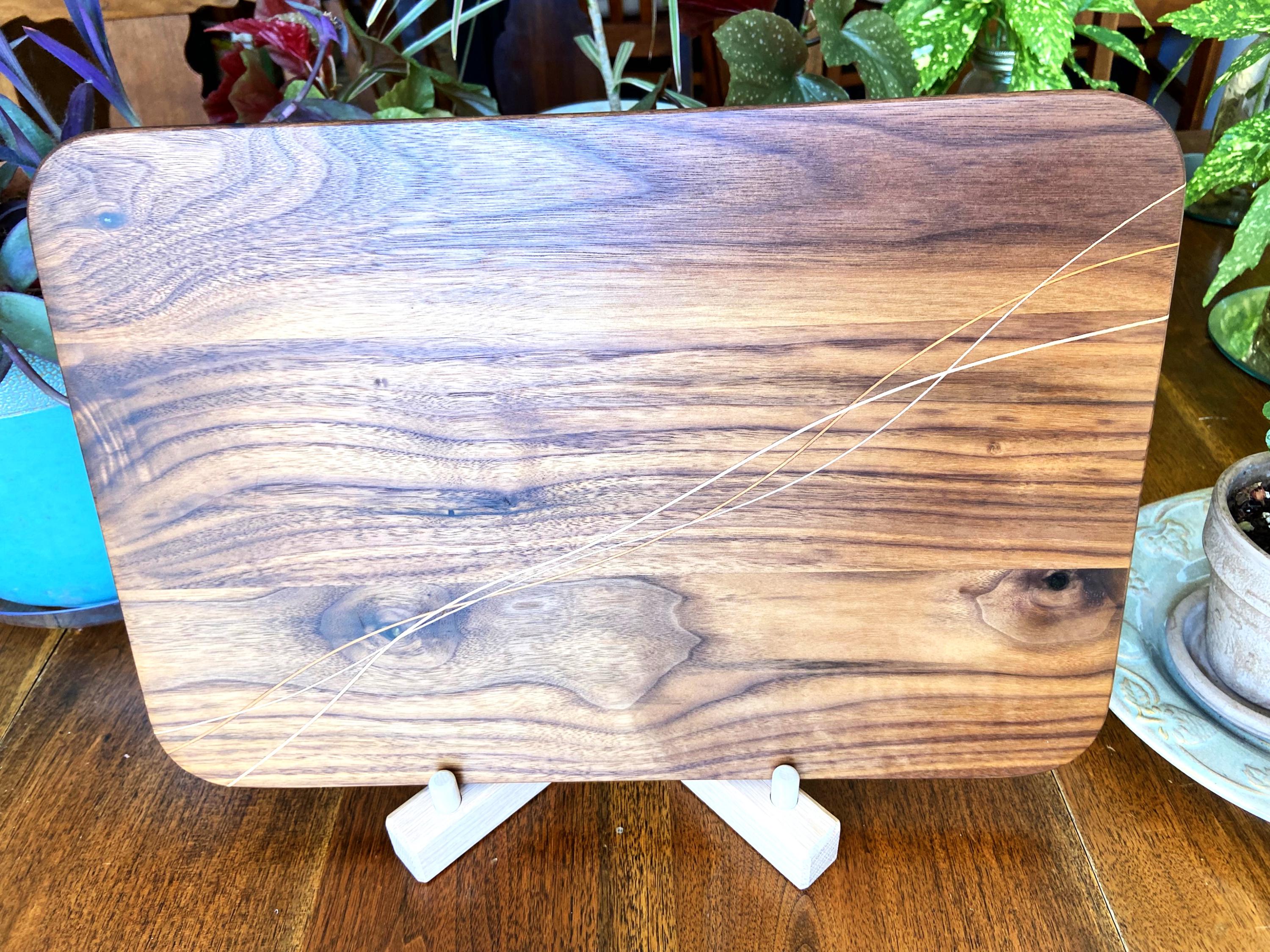 Walnut charcuterie board with Cherry and Maple decorative banding, handcrafted by Fitzgerald Custom Woodcraft