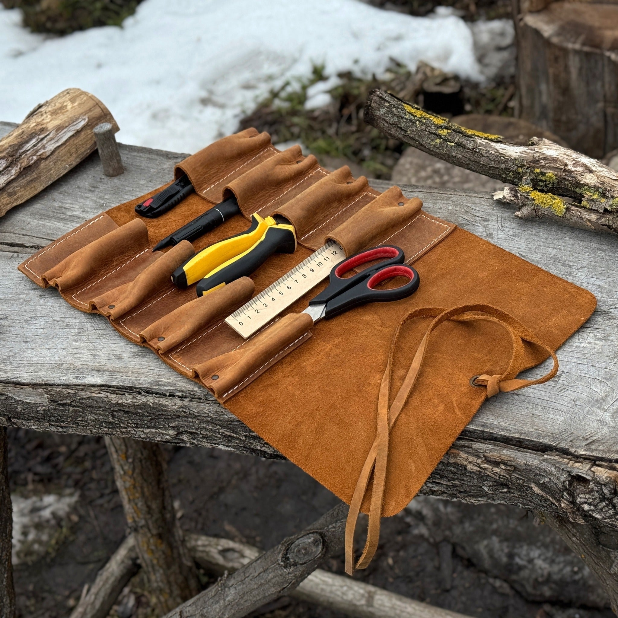 Handmade 8 pocket leather tool roll by Sharky Forged Steel Tools, open with tools inside