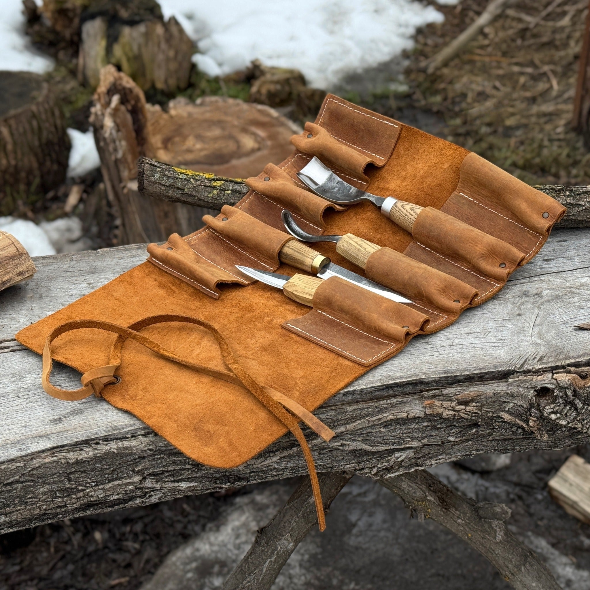 Handmade 8 pocket leather tool roll by Sharky Forged Steel Tools, open with tools inside
