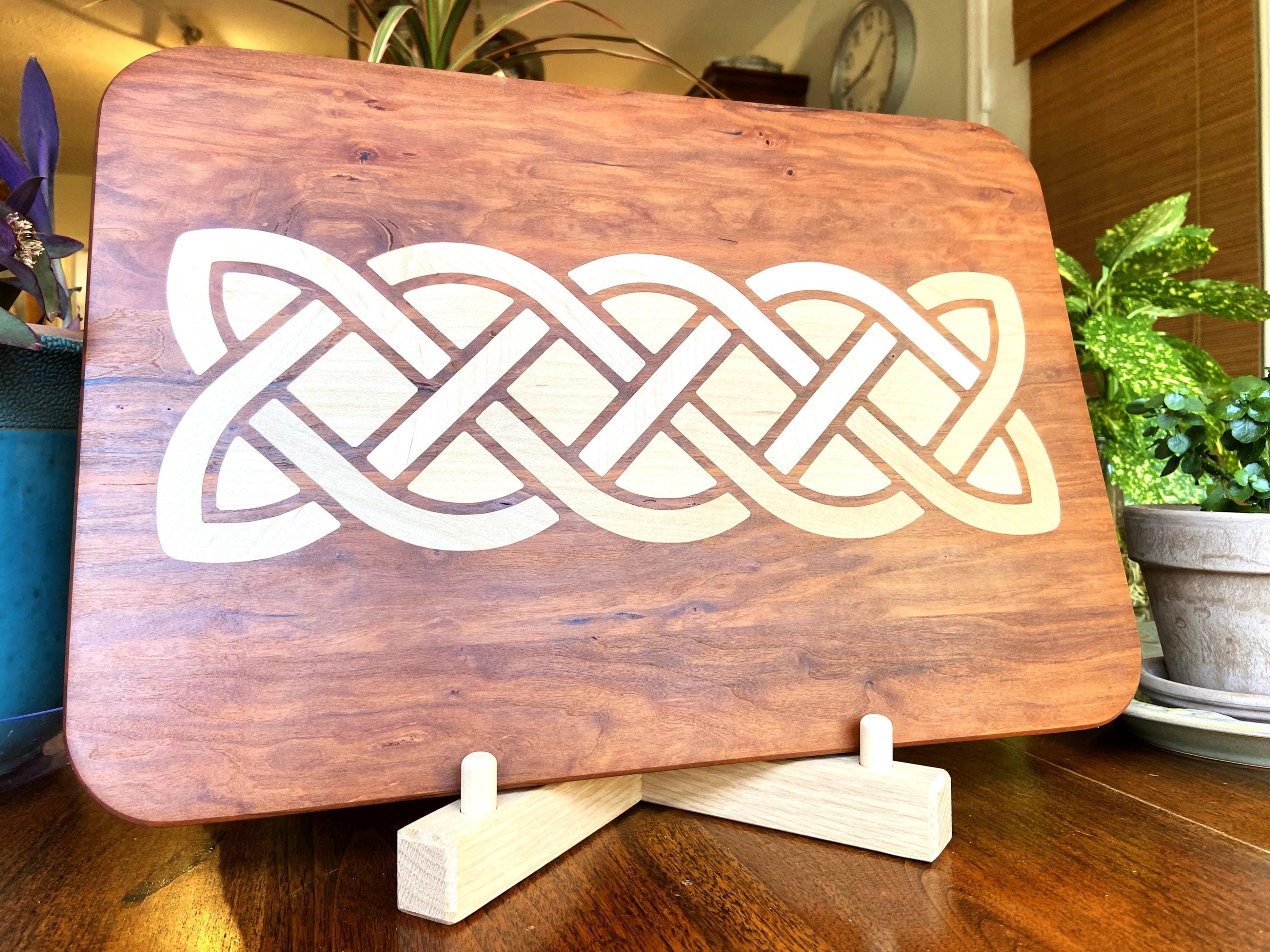Cherry charcuterie board with complex Celtic knot inlay on White Oak wood