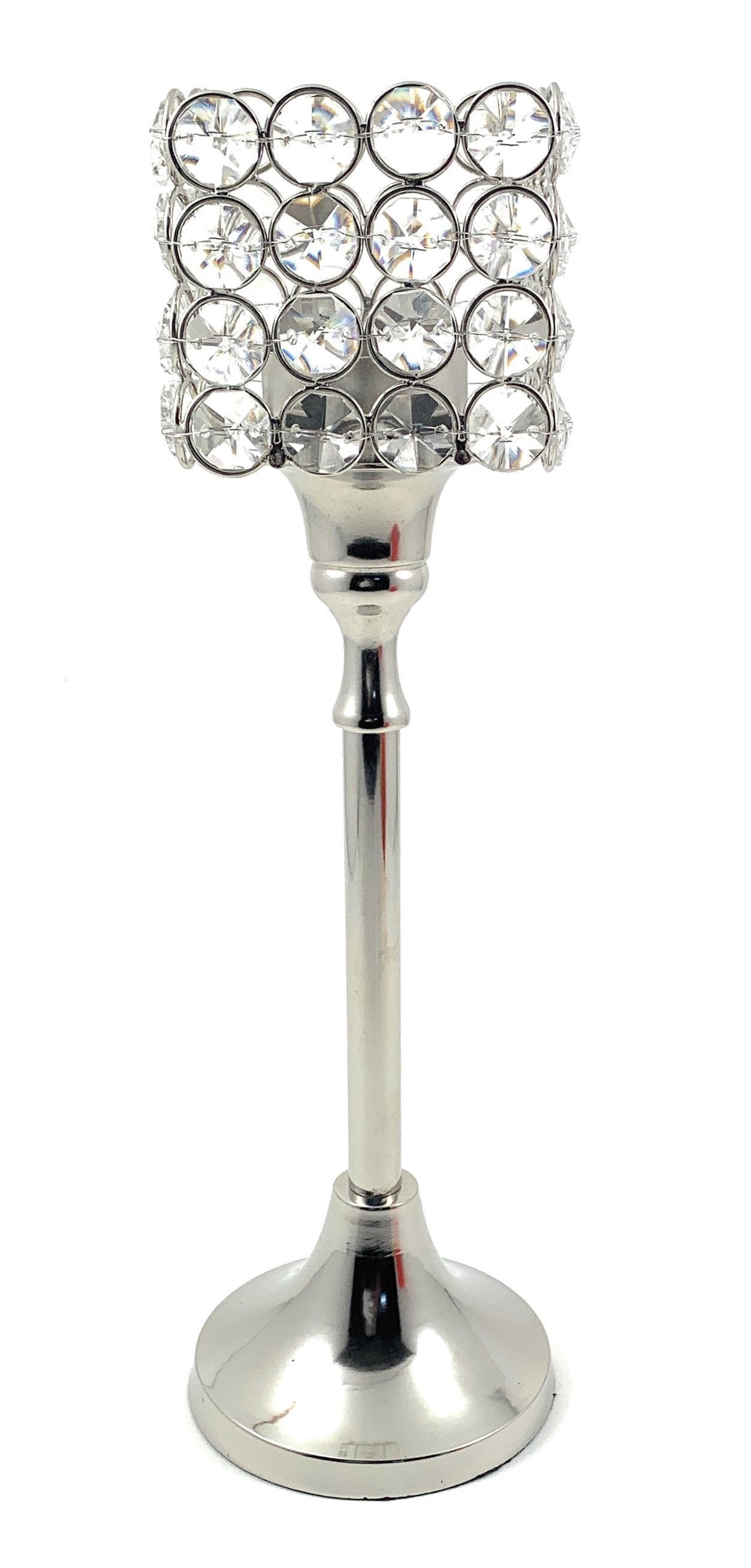 Square crystal candle holder with faceted surfaces reflecting light