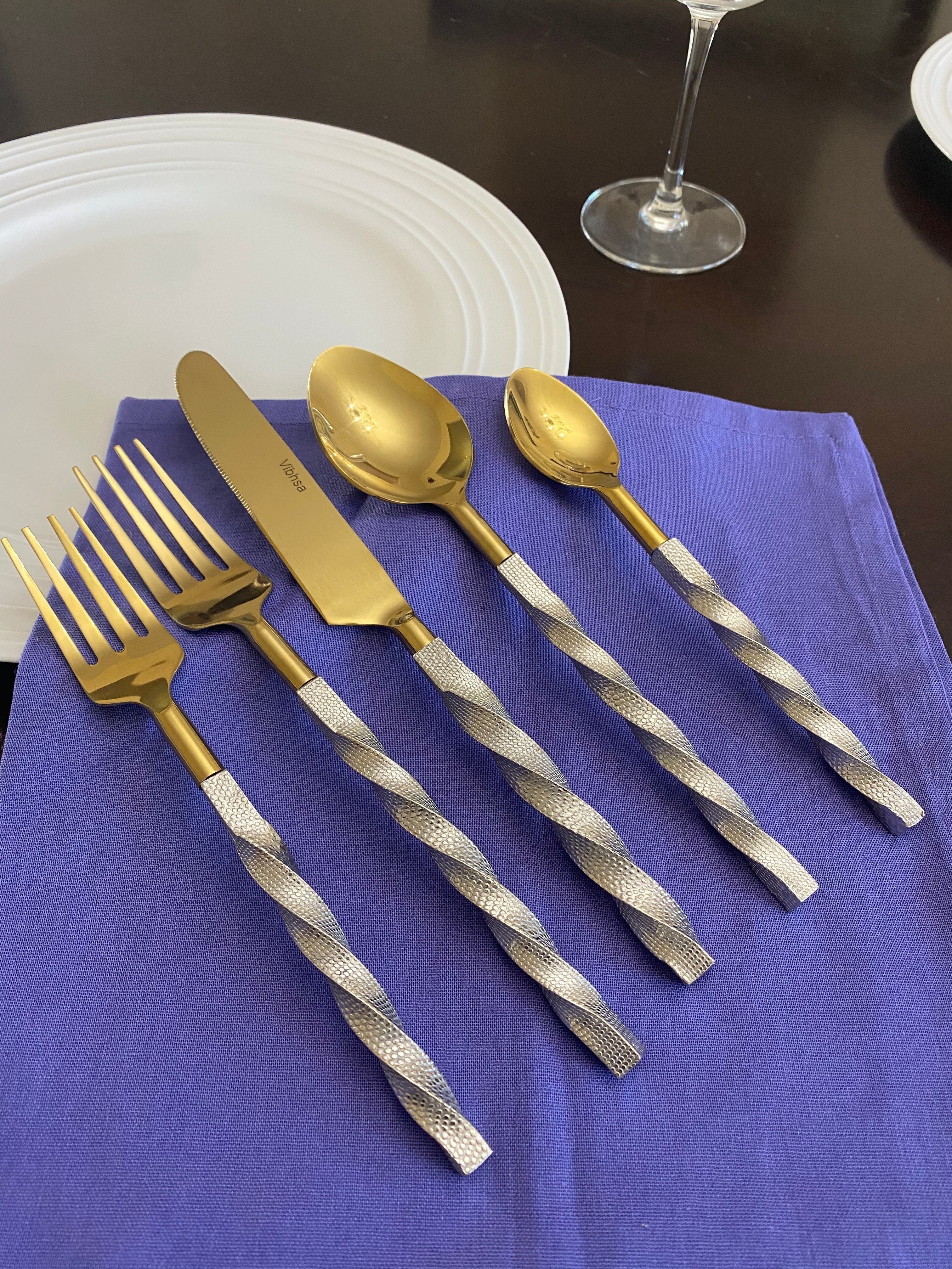 Golden Stainless Steel Flatware Set of 5 pieces with twisted handles displayed on a surface