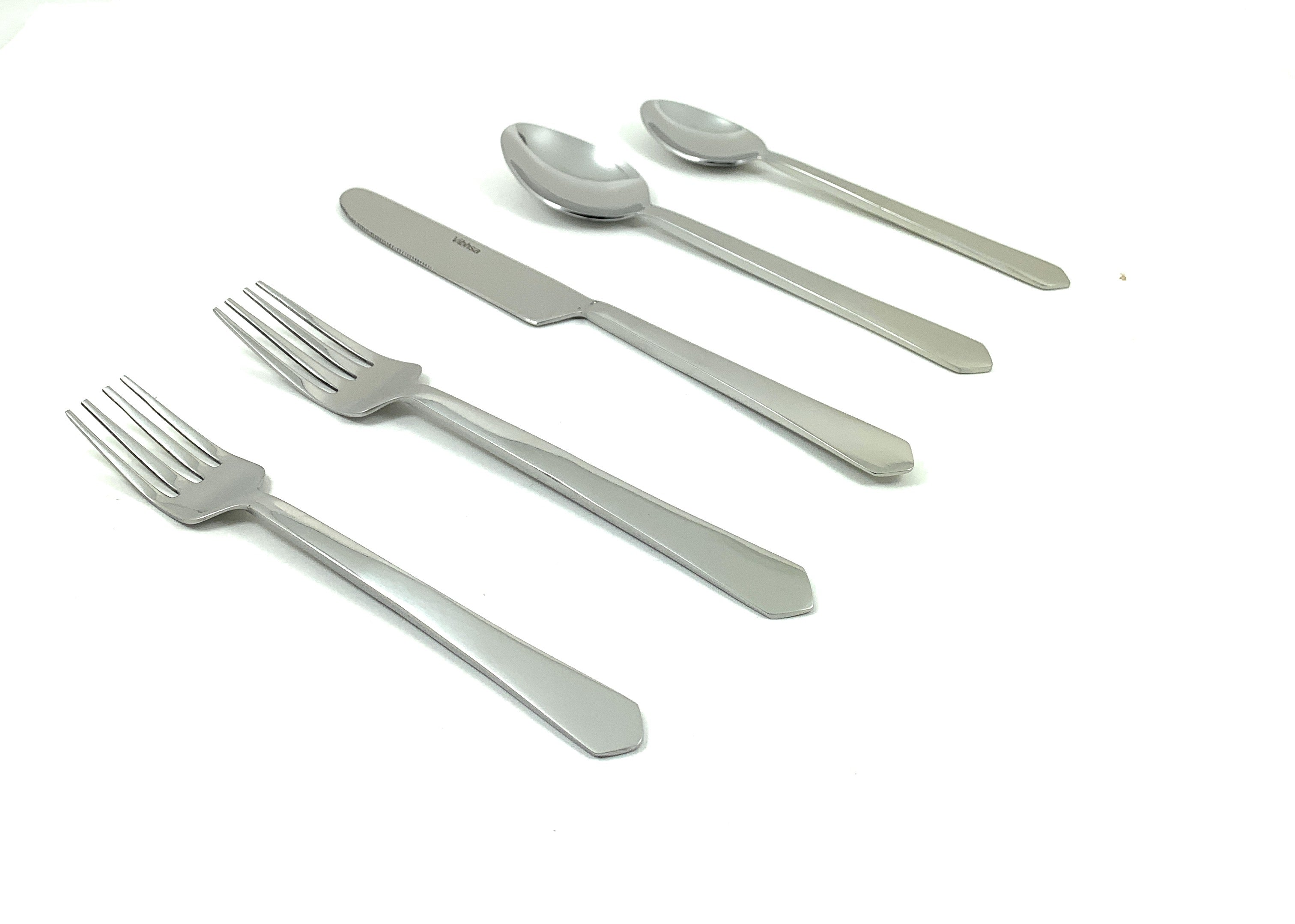 Flatware set of 20 pieces in silver stainless steel with Taj End handles arranged on a white surface