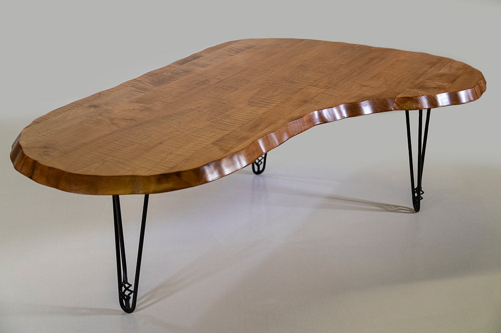 Wavy Kidney Table with EB Hairpin Legs showing tiger maple top and black hairpin legs with spiral-shaped basket