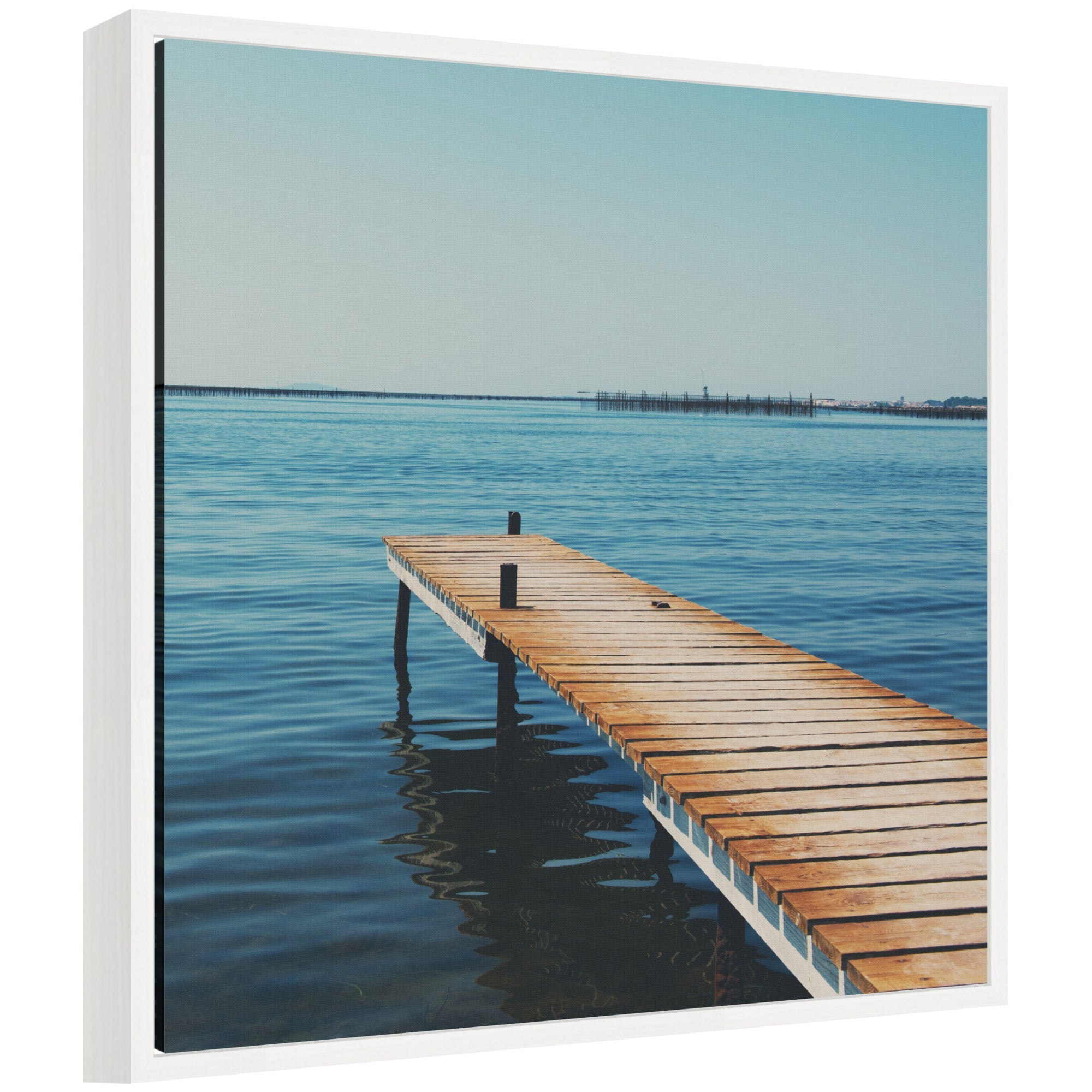 Etang de Thau by Laura Evans framed canvas wall art print showing a coastal scene in a white Sylvie frame