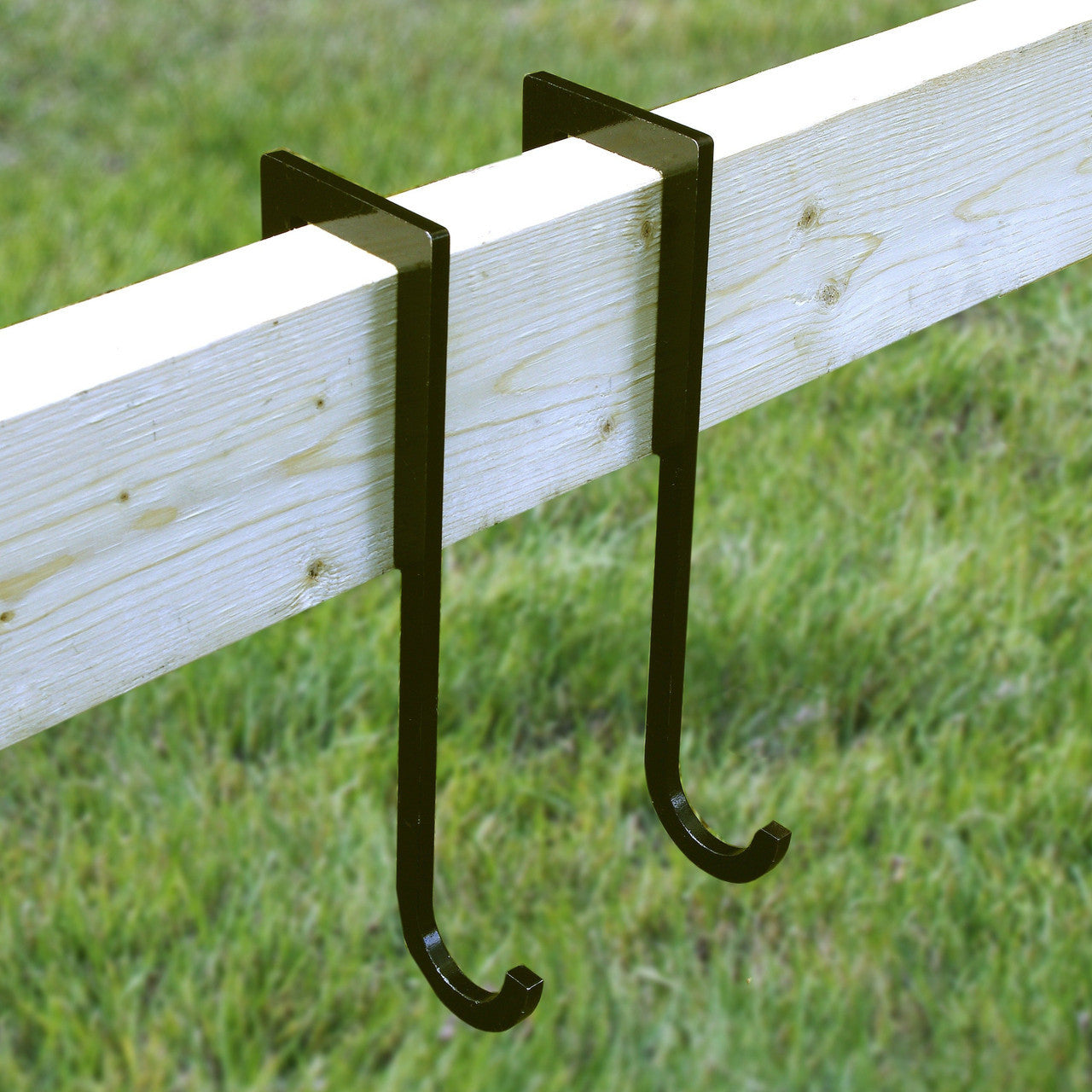 Pair of Target Hangers linked to steel targets in a shooting range setup