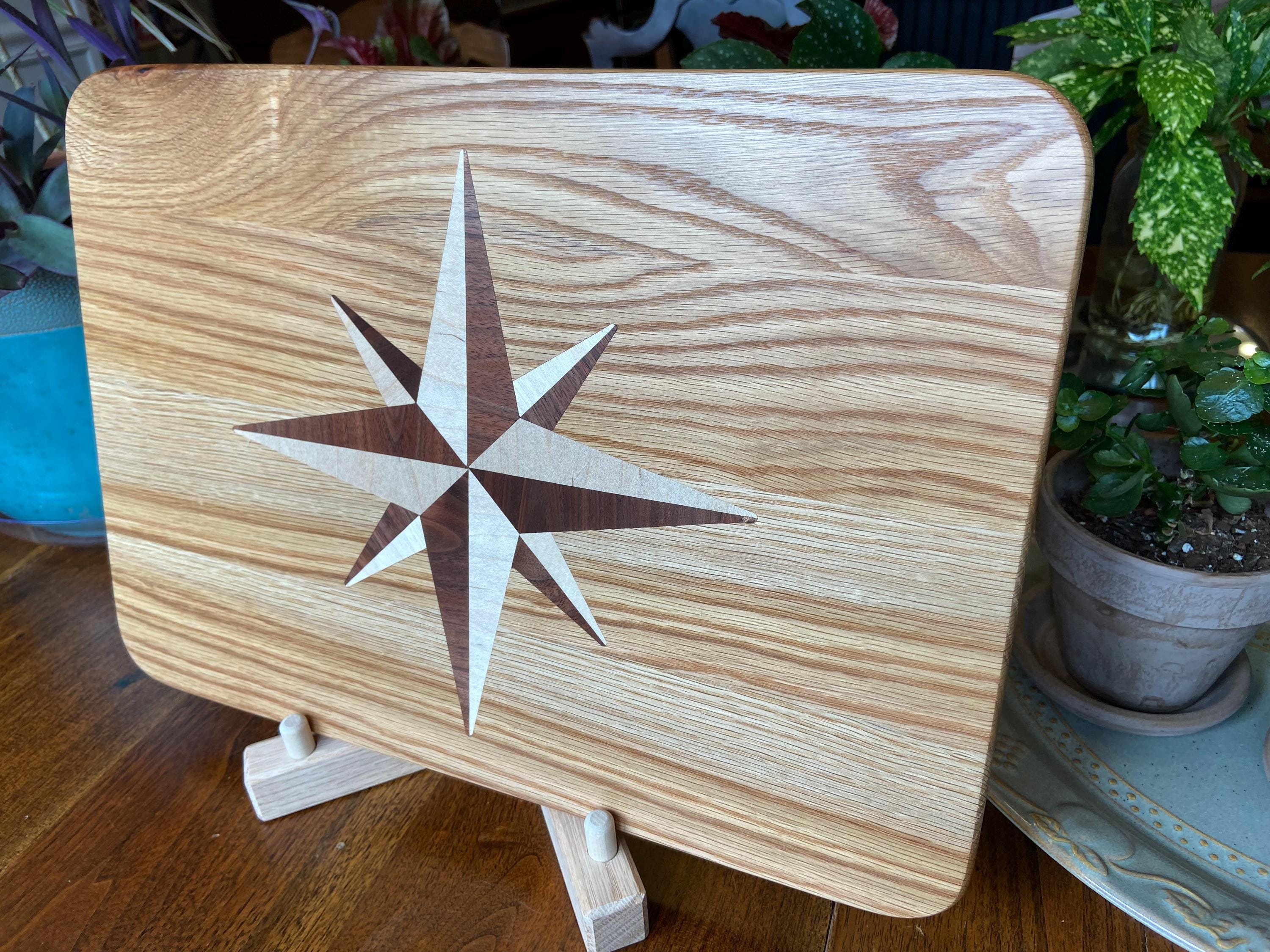 Handcrafted white oak charcuterie board with compass rose inlay