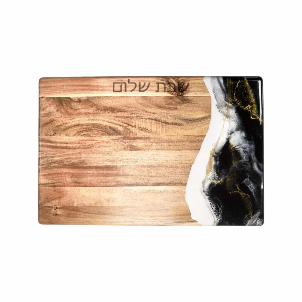 Wooden resin charcuterie board with black and gold abstract design on a white background