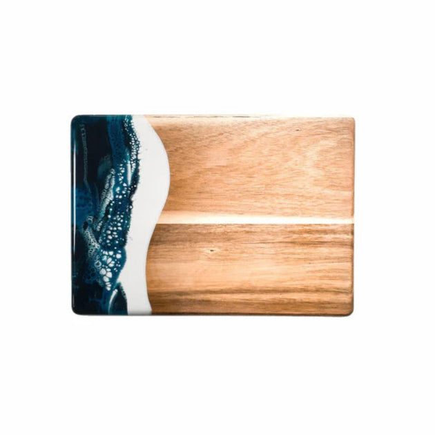 Wooden resin charcuterie board with a blue and white design on a white background