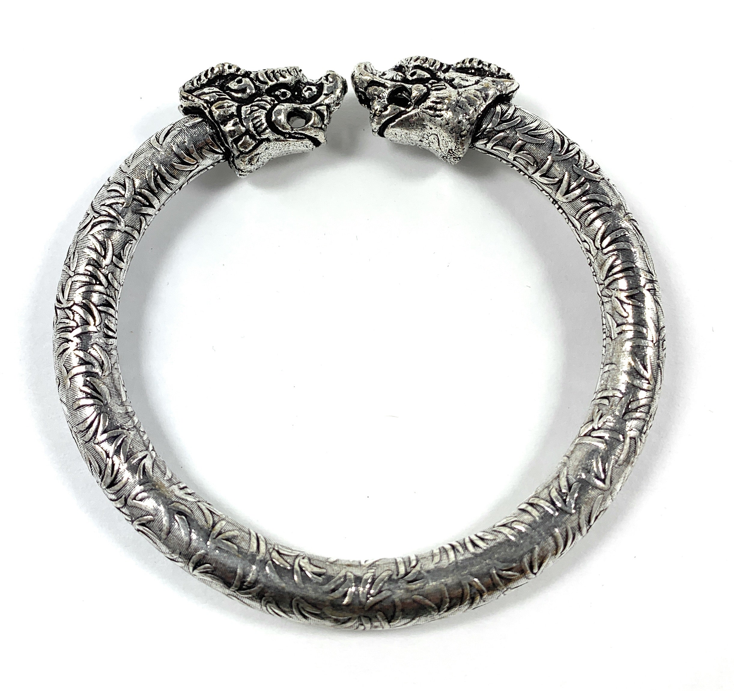 Antique Norse Bracelet with two lion heads and leaf pattern visible
