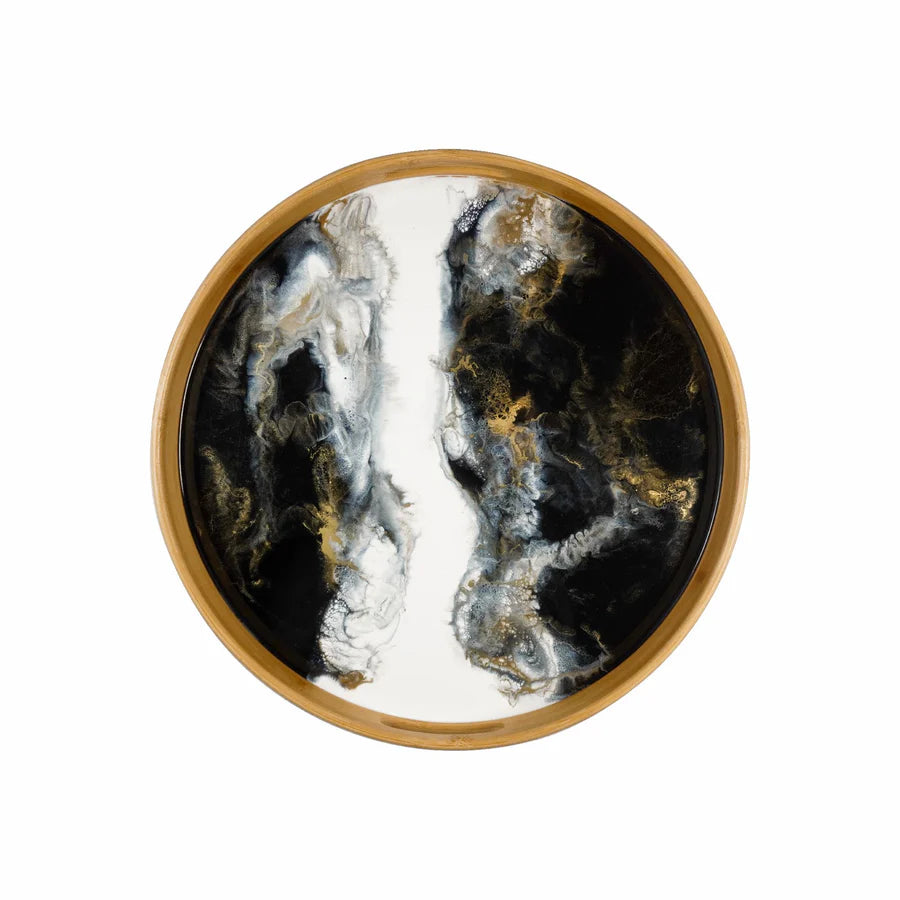 Round decorative resin serving tray with black, white, and gold marbled design on a wooden rim.