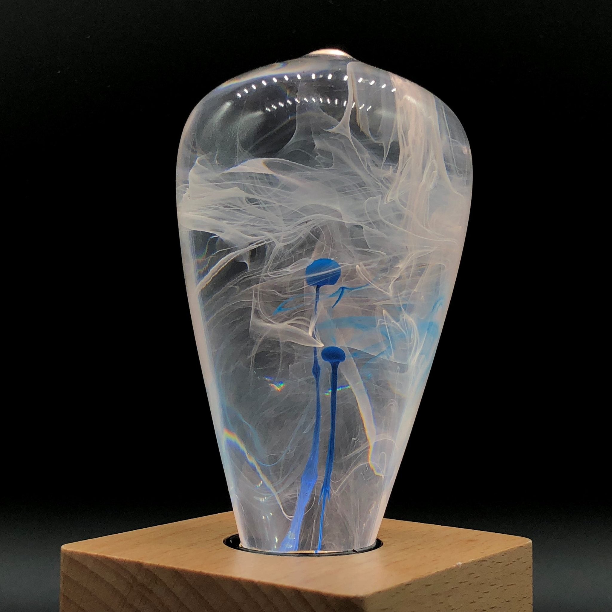 EP Light BlueDrop Resin Table Lamp with wooden base and glowing LED bulb