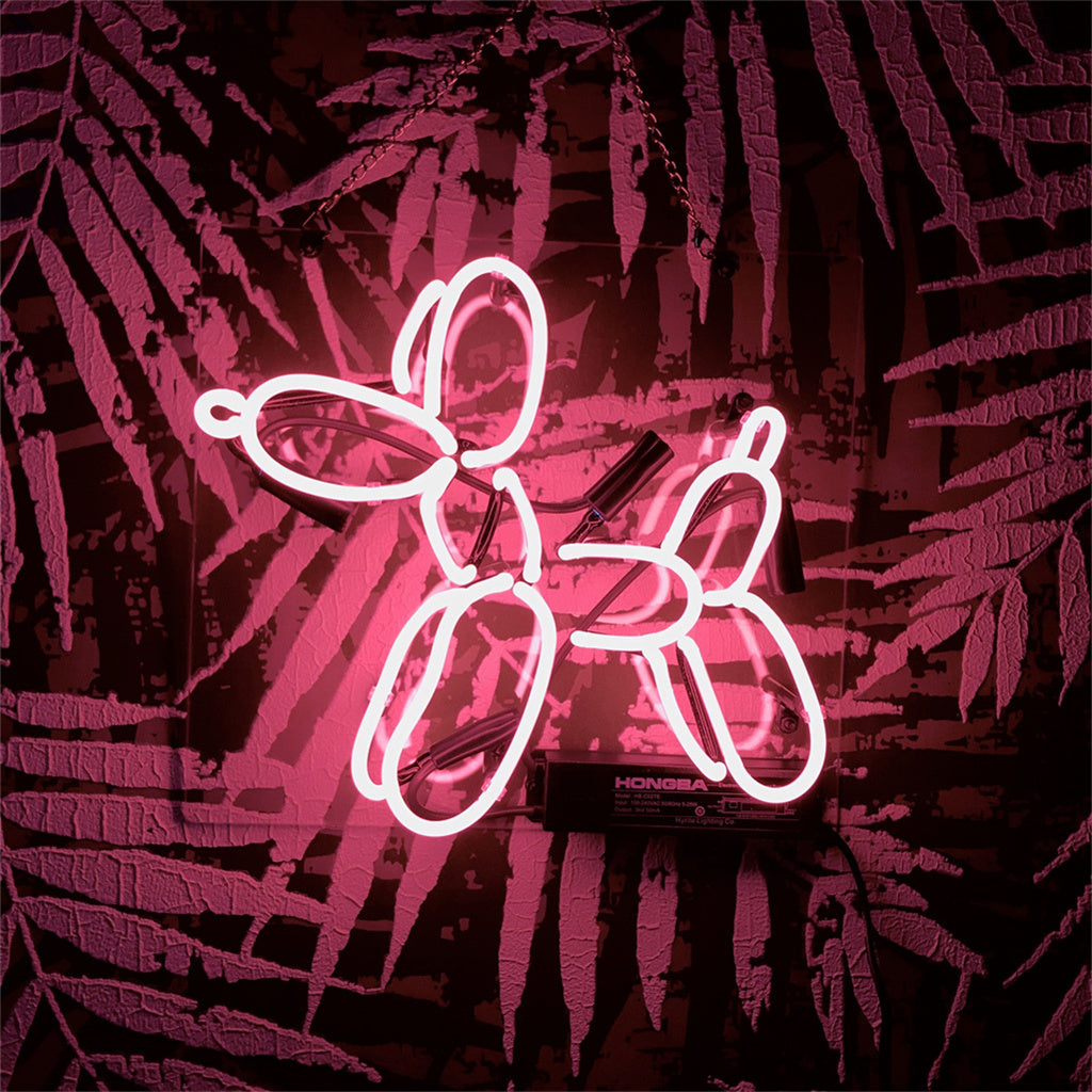 Illuminated Balloon Dog neon light mounted on acrylic backing in an interior setting
