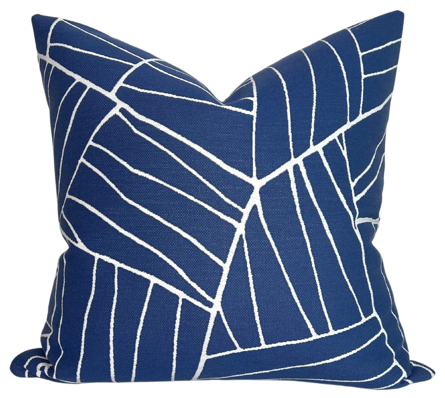 Jordan Woven Pillow Cover in Royal Blue displayed on a sofa with ivory performance fabric backing visible