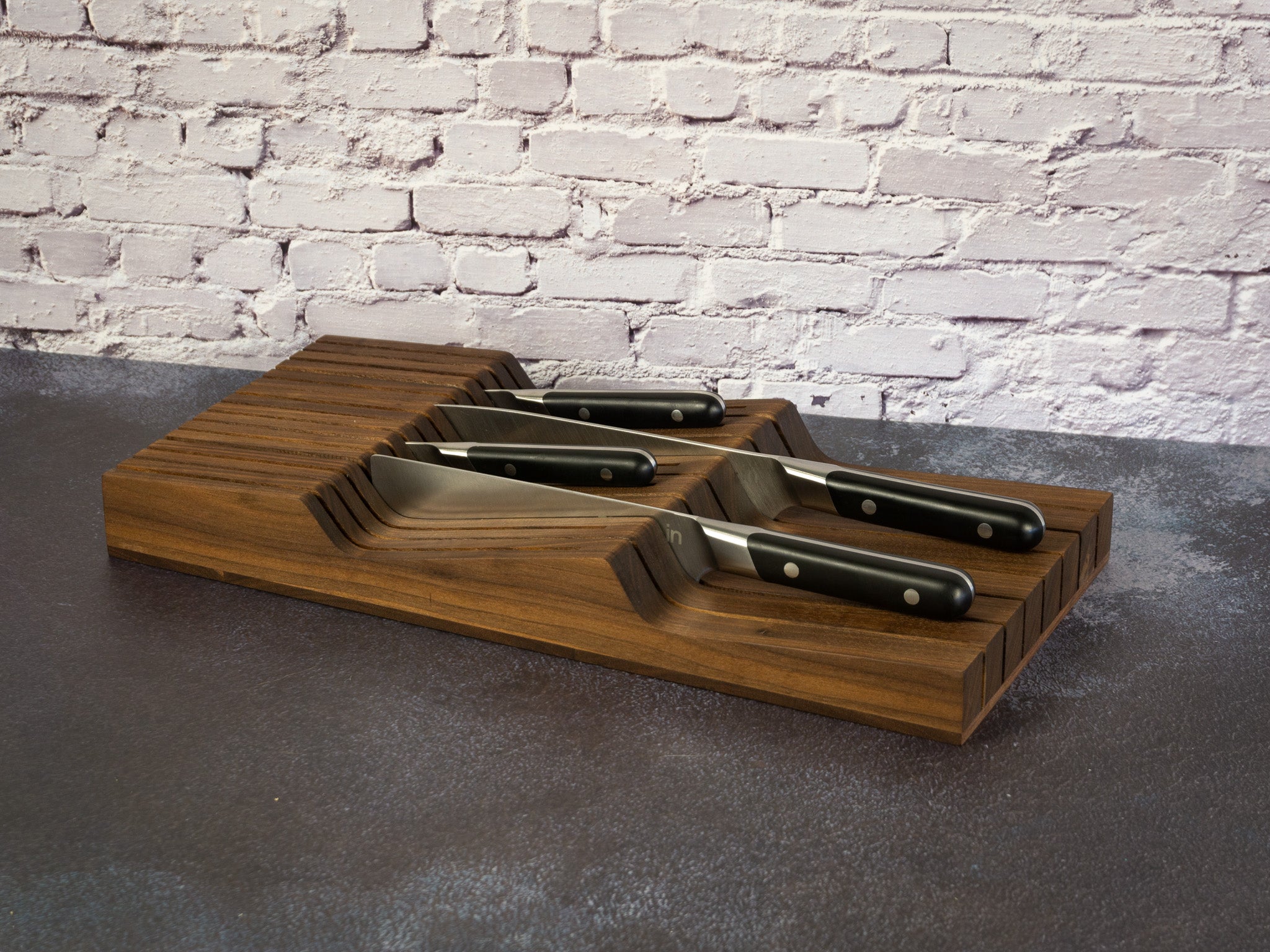 Old Saguaro Woodcraft In-Drawer Knife Block with knives arranged inside a kitchen drawer