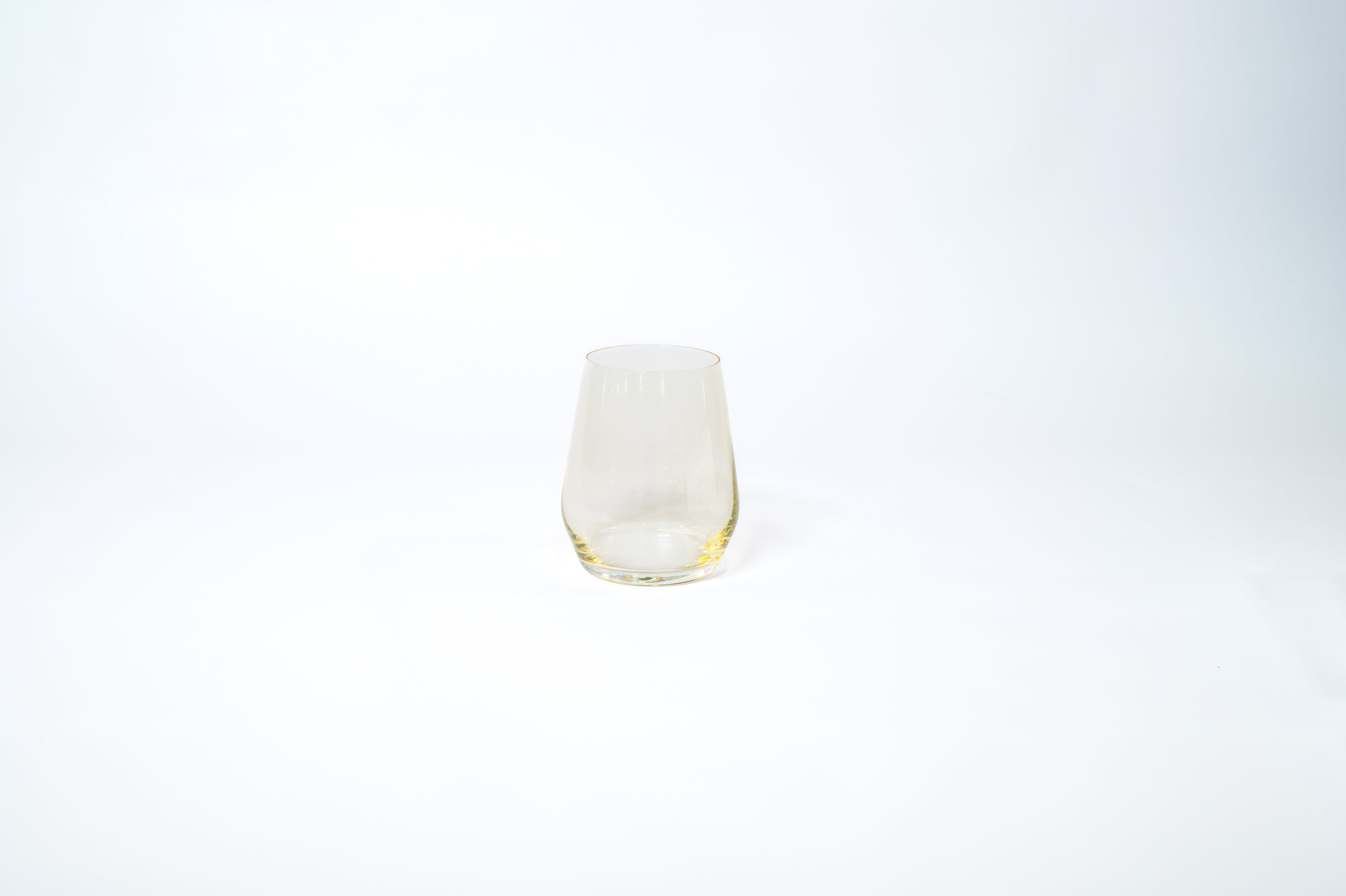 Yellow stemless wine glass from the Golden Hour Ombré Collection by glasshauseco