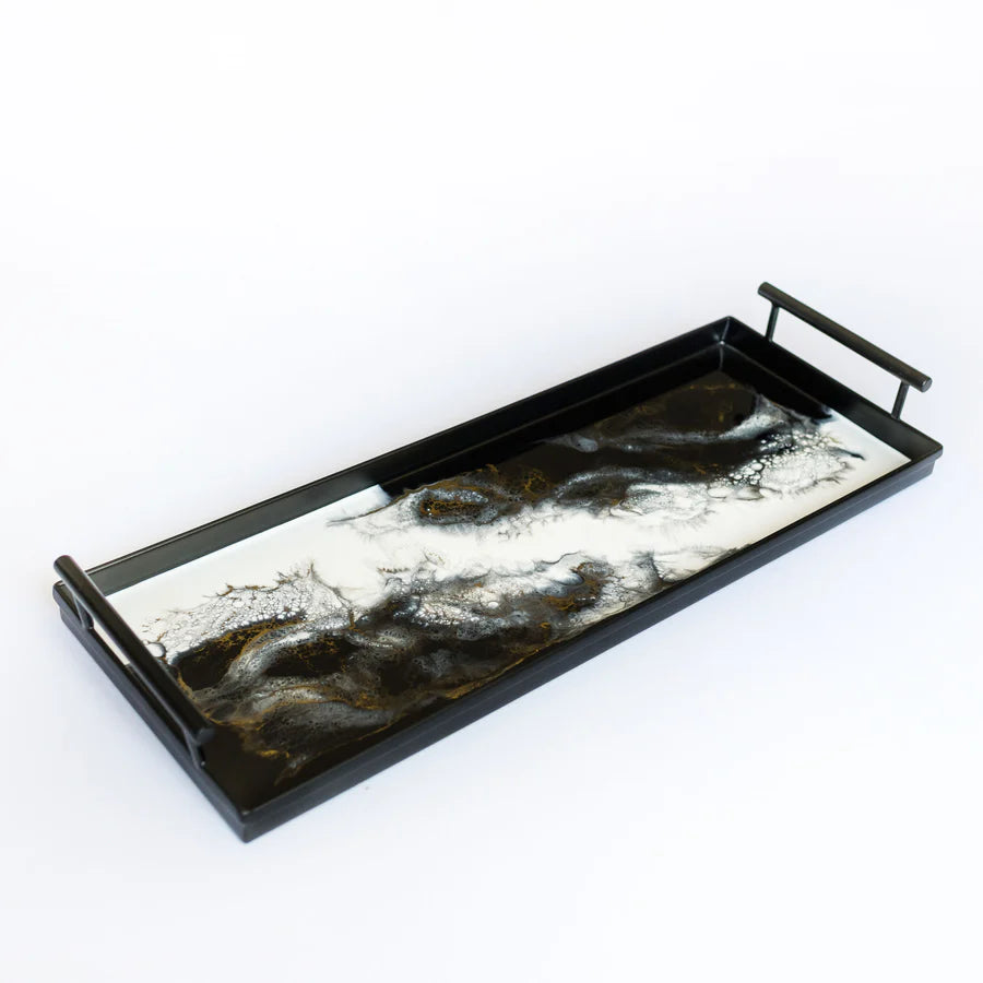Rectangular resin tray with black and white abstract design on a white background