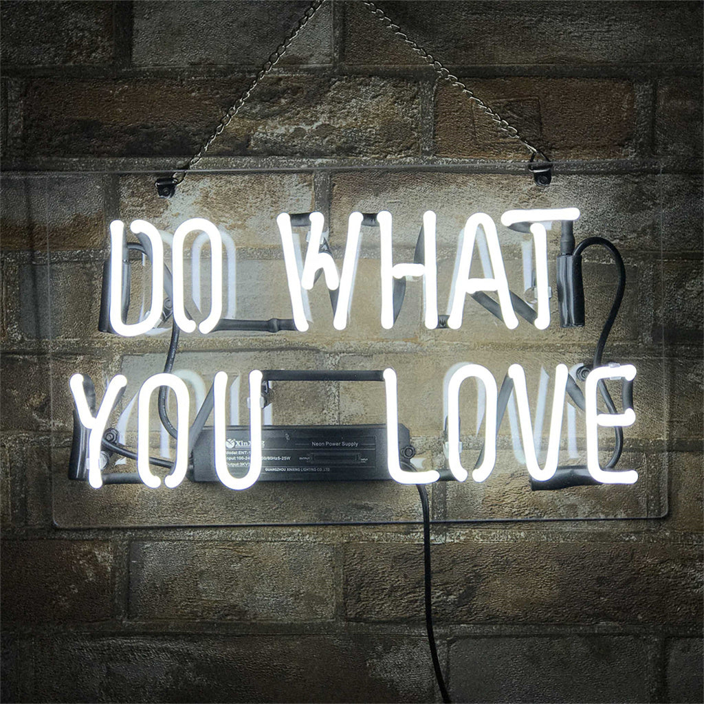 Do What You Love Neon Sign with glowing pink script on a light background