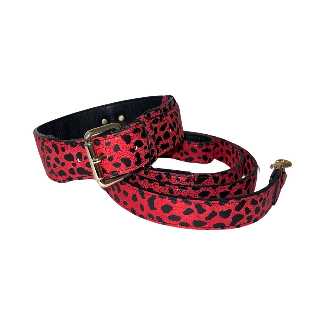 Red and black leopard print Italian leather dog collar and leash set laid out flat.