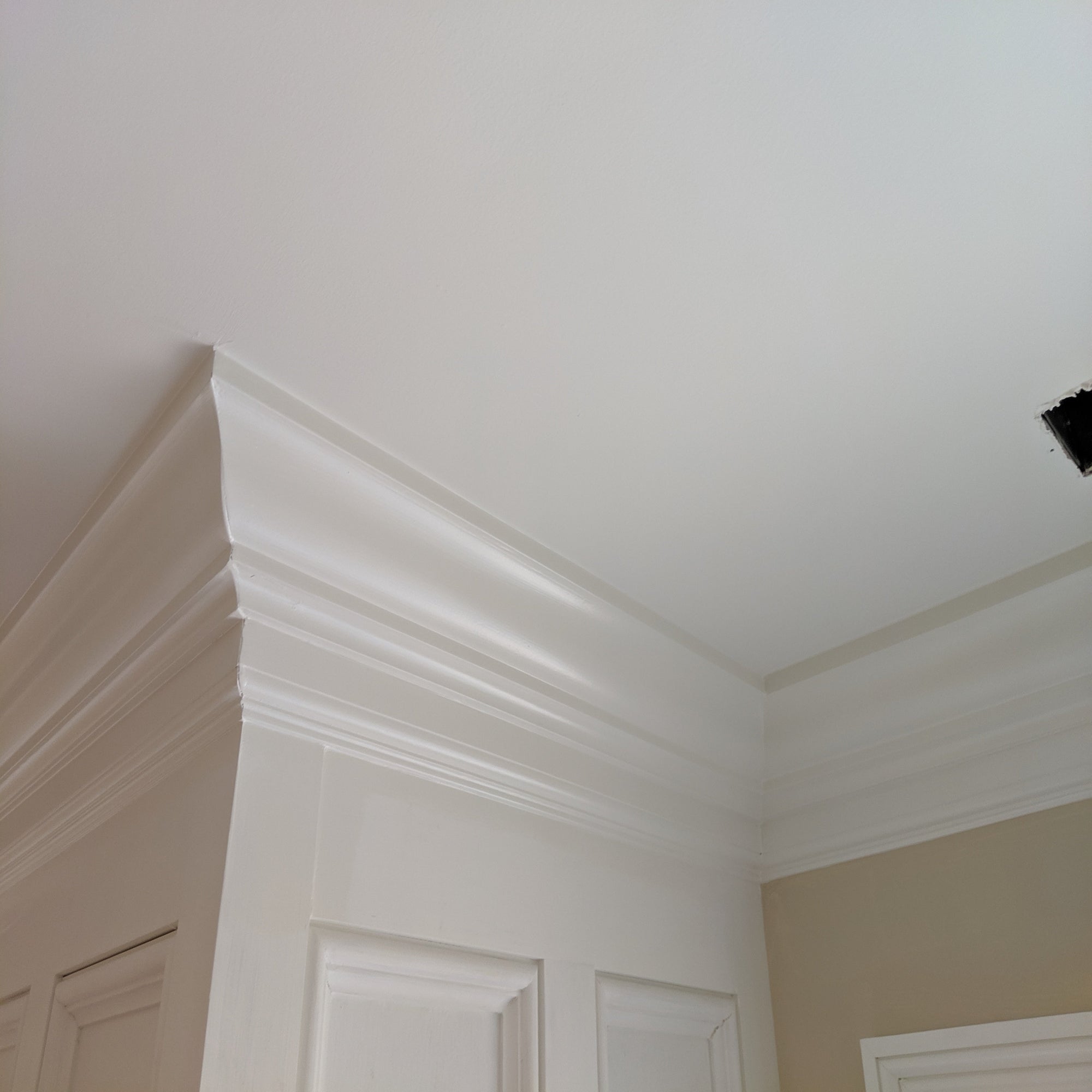 EWCR13 unfinished hardwood crown molding showing profile and natural wood grain