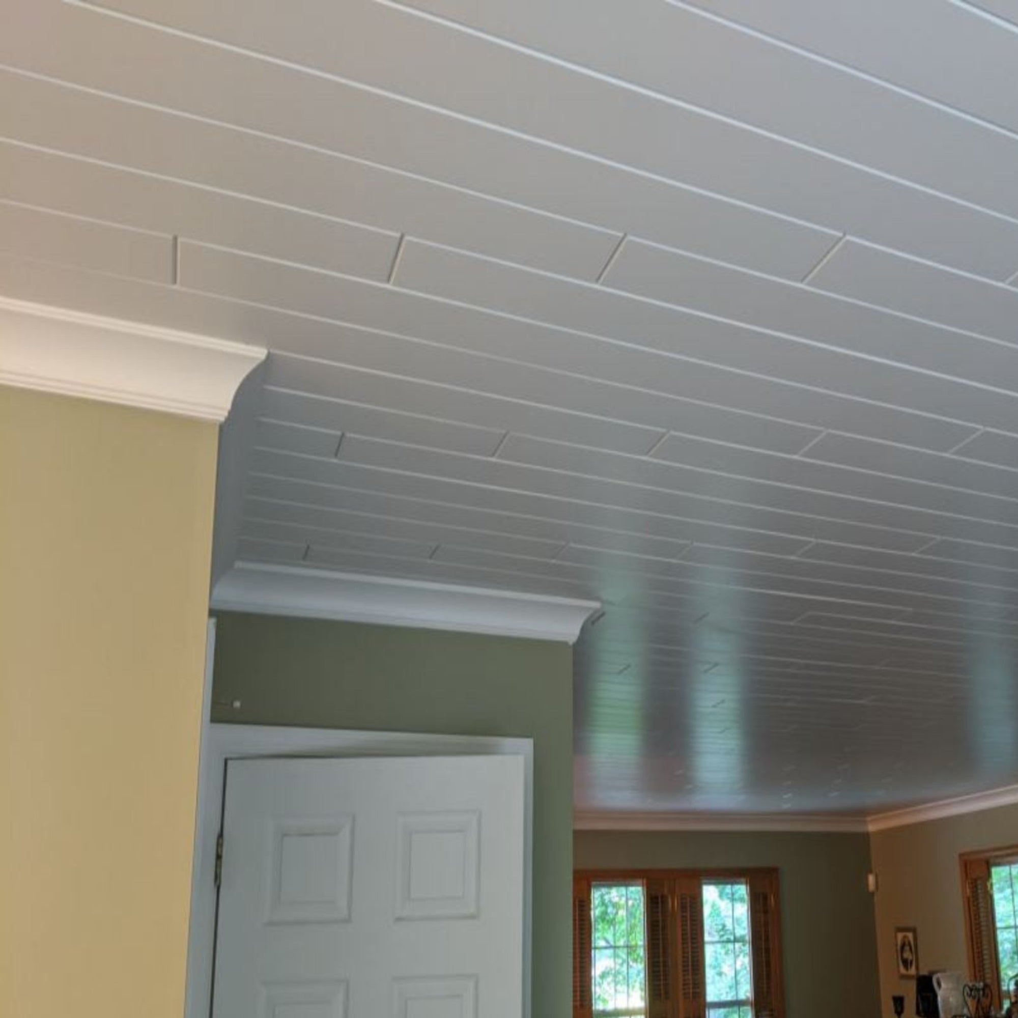 EWCR43 Cove Crown unfinished hardwood molding showing profile and wood grain